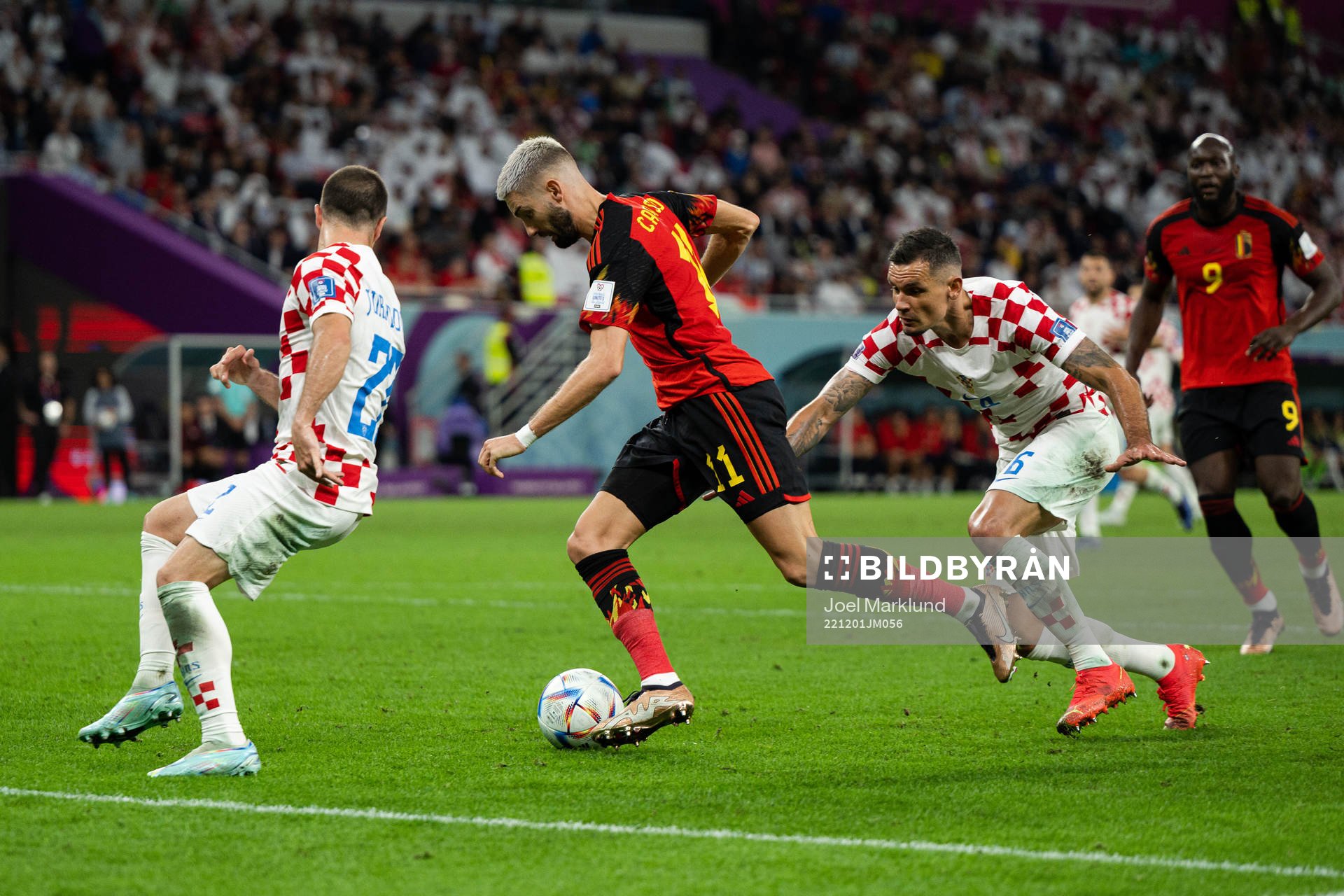 Yannick Carrasco of Belgium against Josip Juranovic and Dejan Lovren of Croatia during the FIFA World Cup 2022 football match between Croatia and Belgium on December 1, 2022 in Doha.