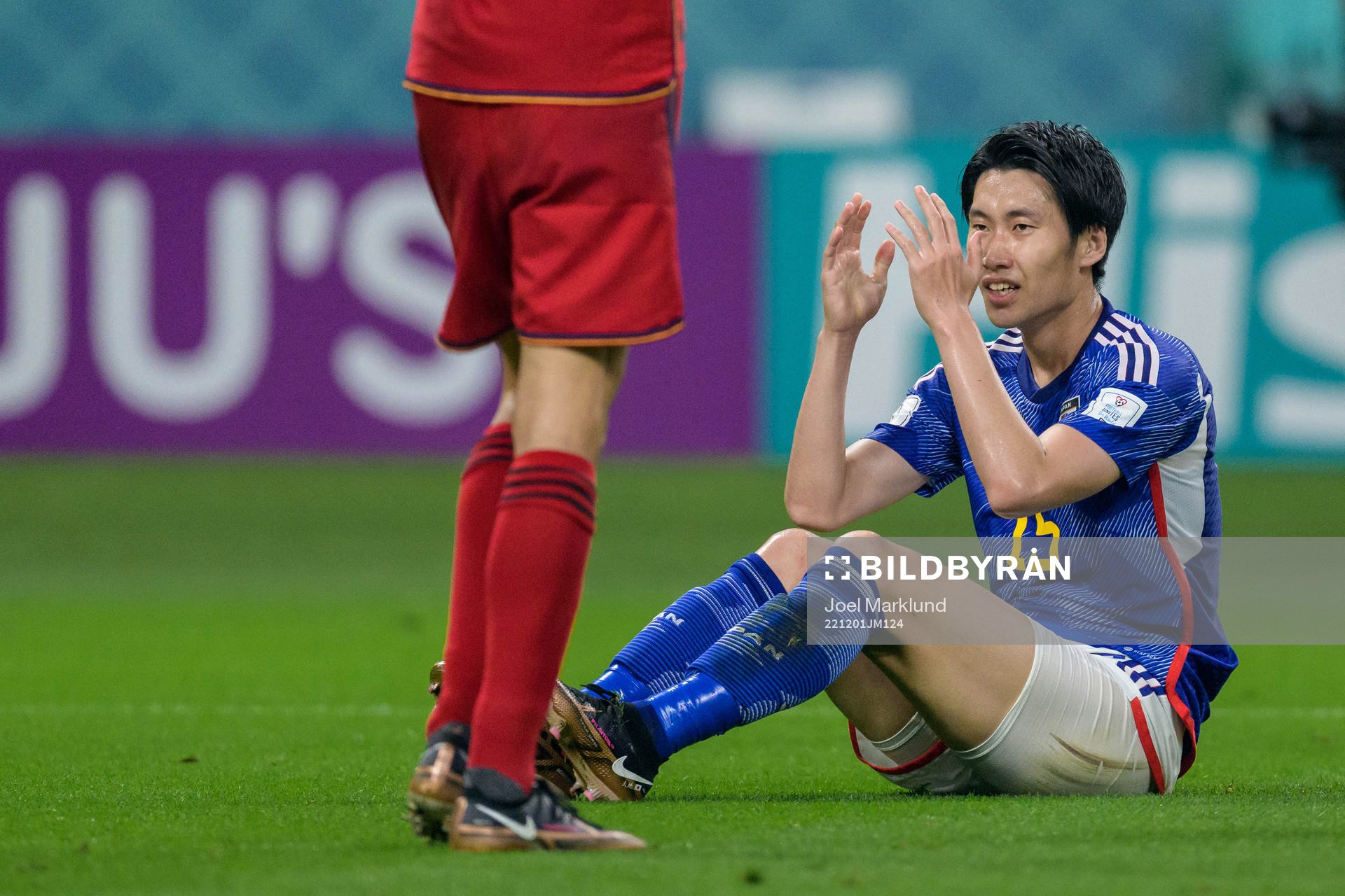 Daichi Kamada of Japan looks dejected