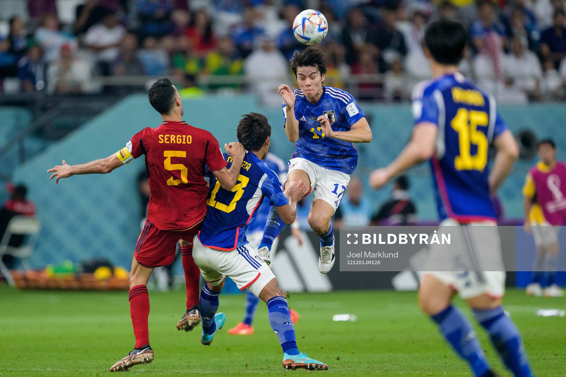 Sergio Busquets of Spain against Hidemasa Morita and Ao