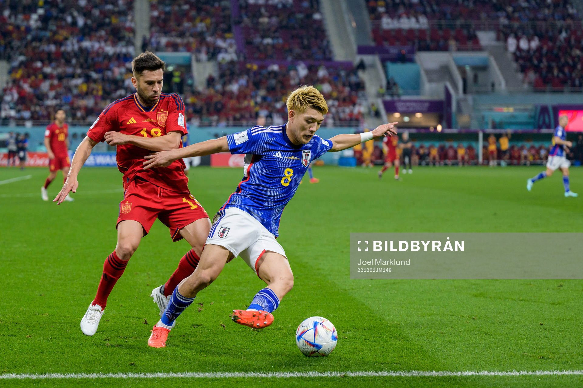 Jordi Alba of Spain and Ritsu Doan of Japan during the FIFA World Cup 2022 football match between Japan and Spain on December 1, 2022 in Doha.