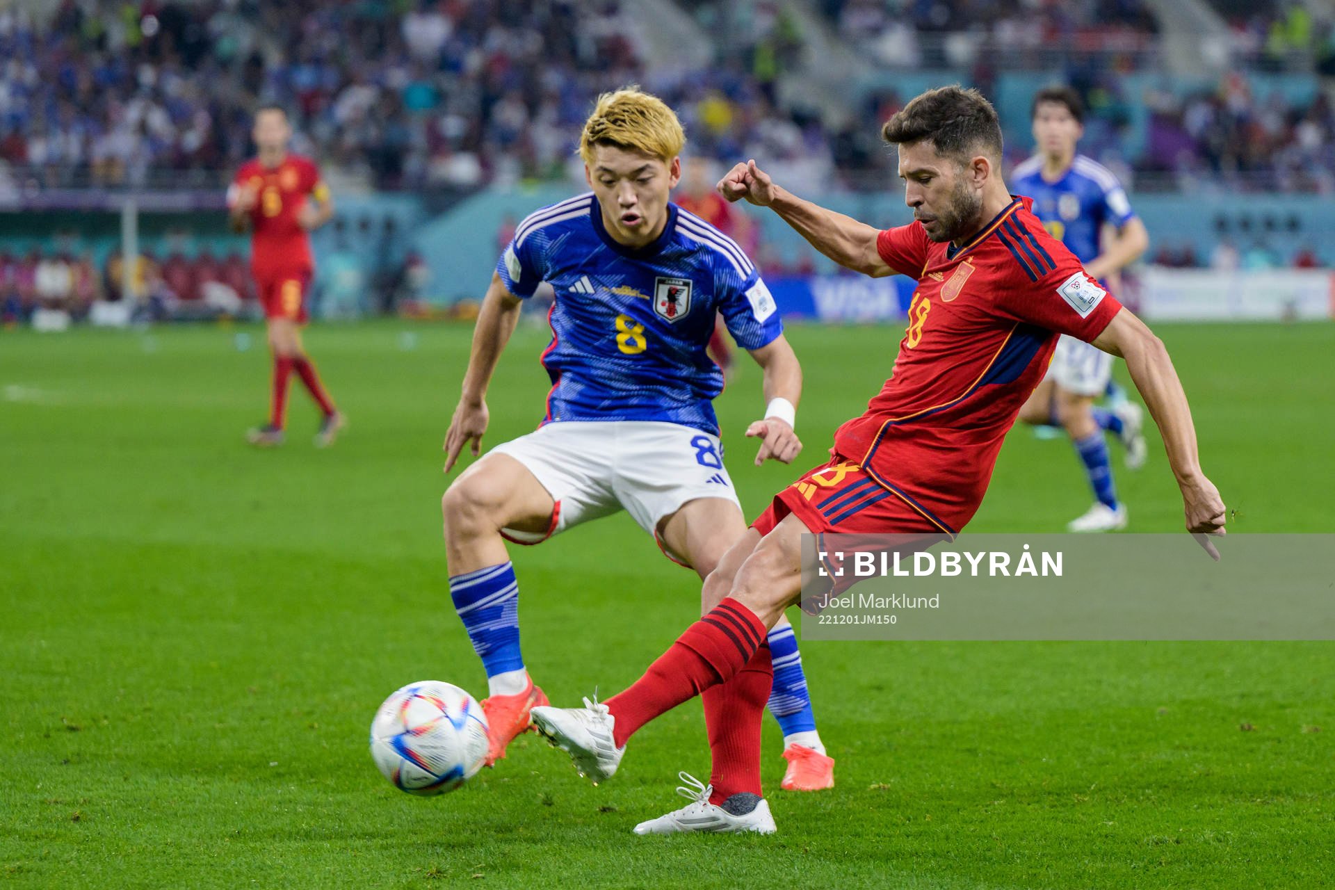 Ritsu Doan of Japan and Jordi Alba of Spain