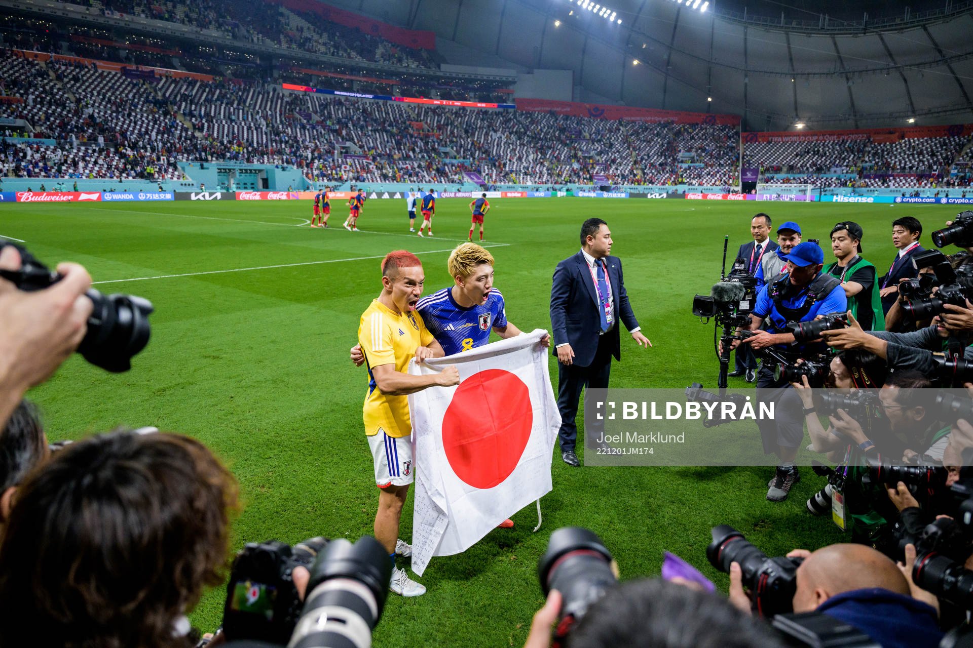 Yuto Nagatomo and Ritsu Doan of Japan celebrate