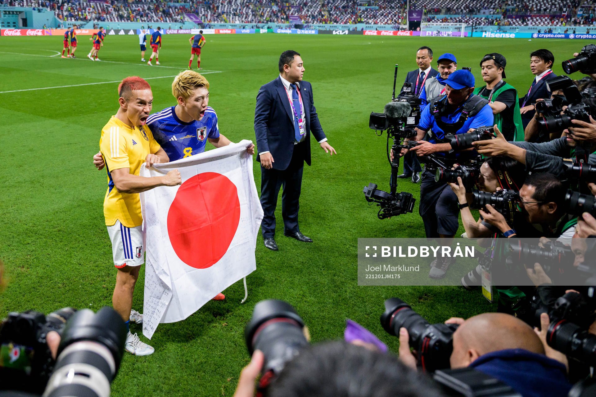 Yuto Nagatomo and Ritsu Doan of Japan celebrate