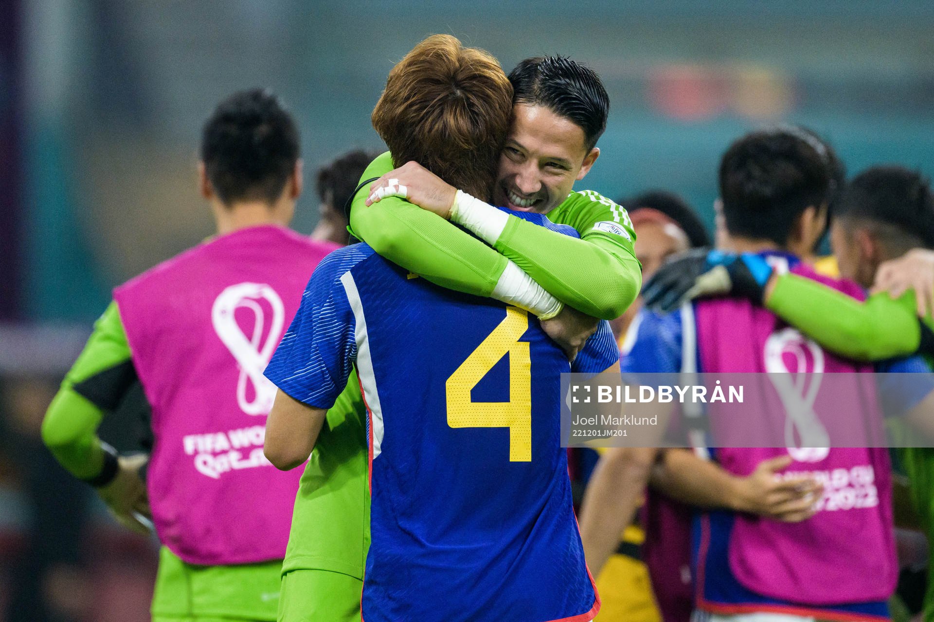 Kou Itakura and goalkeeper Eiji Kawashima of Japan celebrate