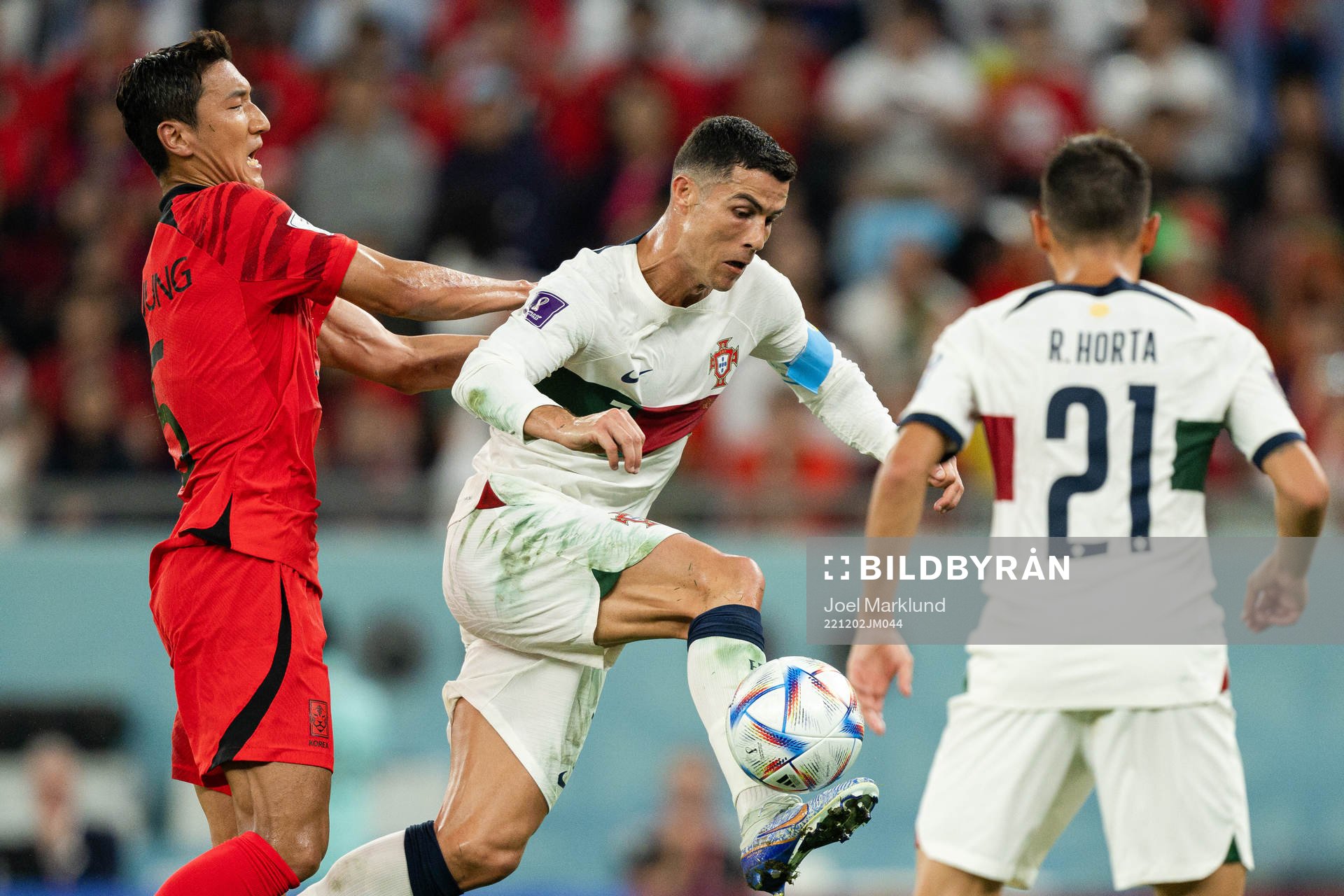 Wooyoung Jung of South Korea and Cristiano Ronaldo of