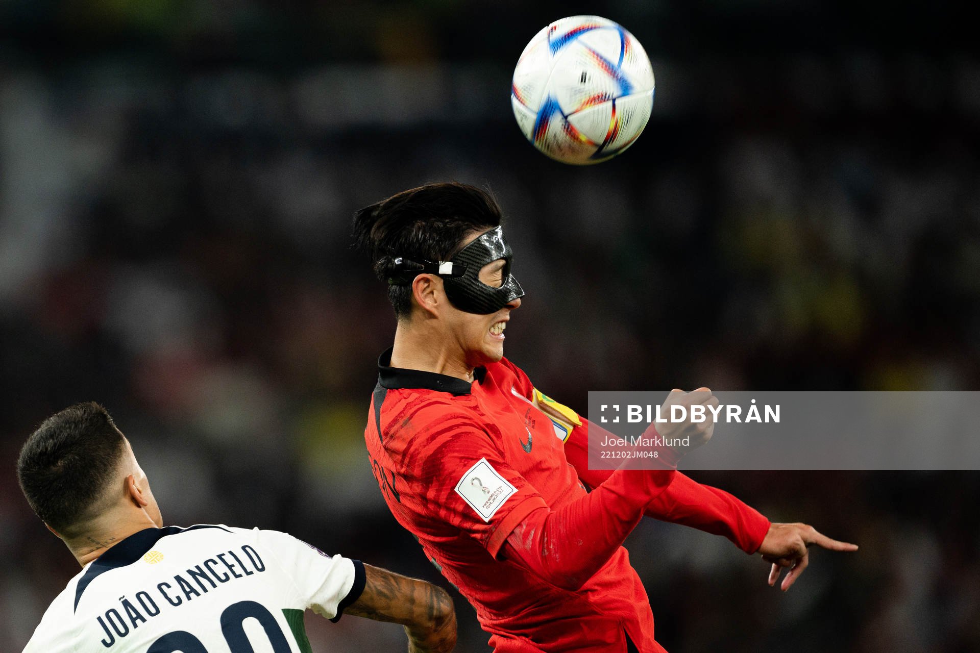 Joao Cancelo of Portugal and Heungmin Son of South Korea