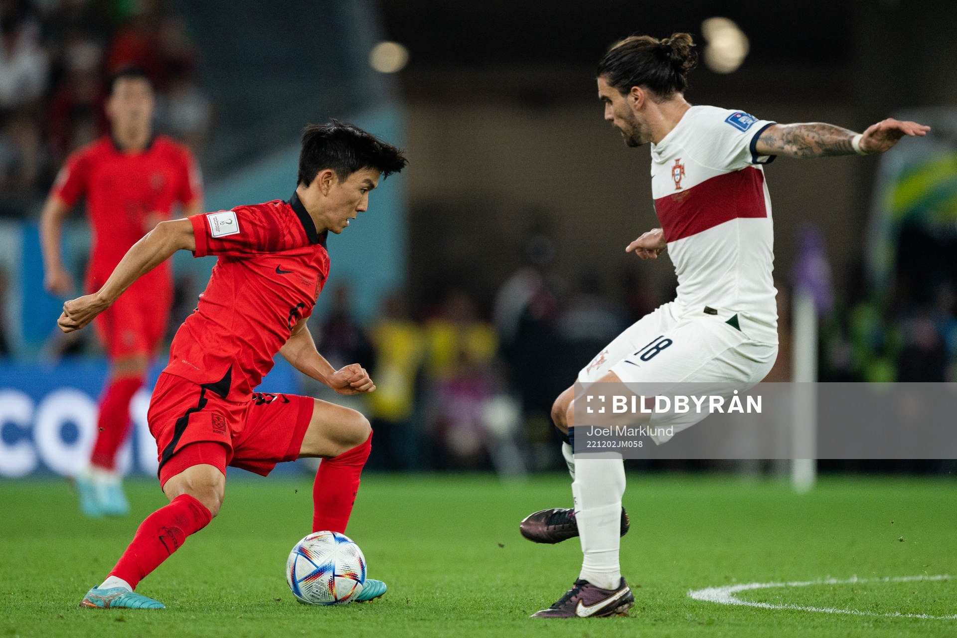 Inbeom Hwang of South Korea and Ruben Neves of Portugal