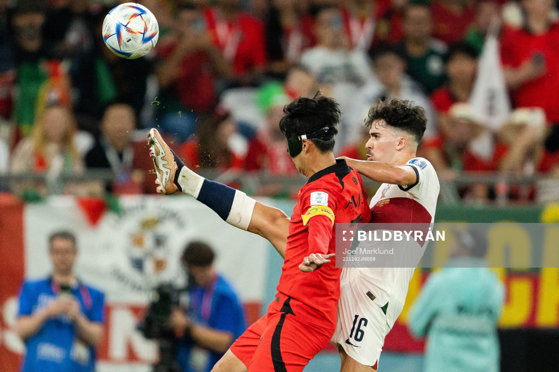 Heungmin Son of South Korea and Vitinha of Portugal