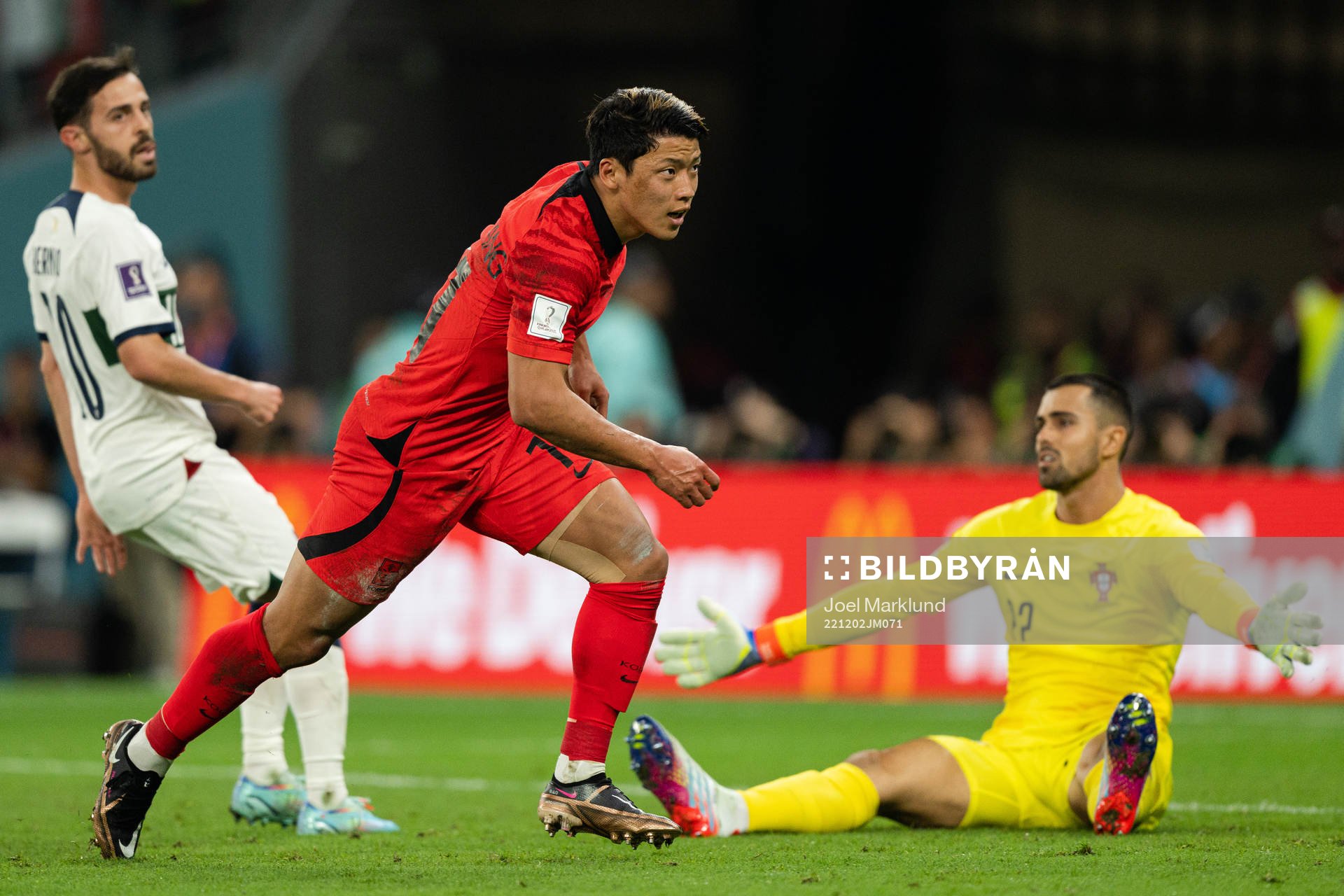 Heechan Hwang of South Korea celebrates the 2-1 goal behind Bernardo Silva and goalkeeper Diogo Costa of Portugal during the FIFA World Cup 2022 football match between South Korea and Portugal on December 2, 2022 in Doha.