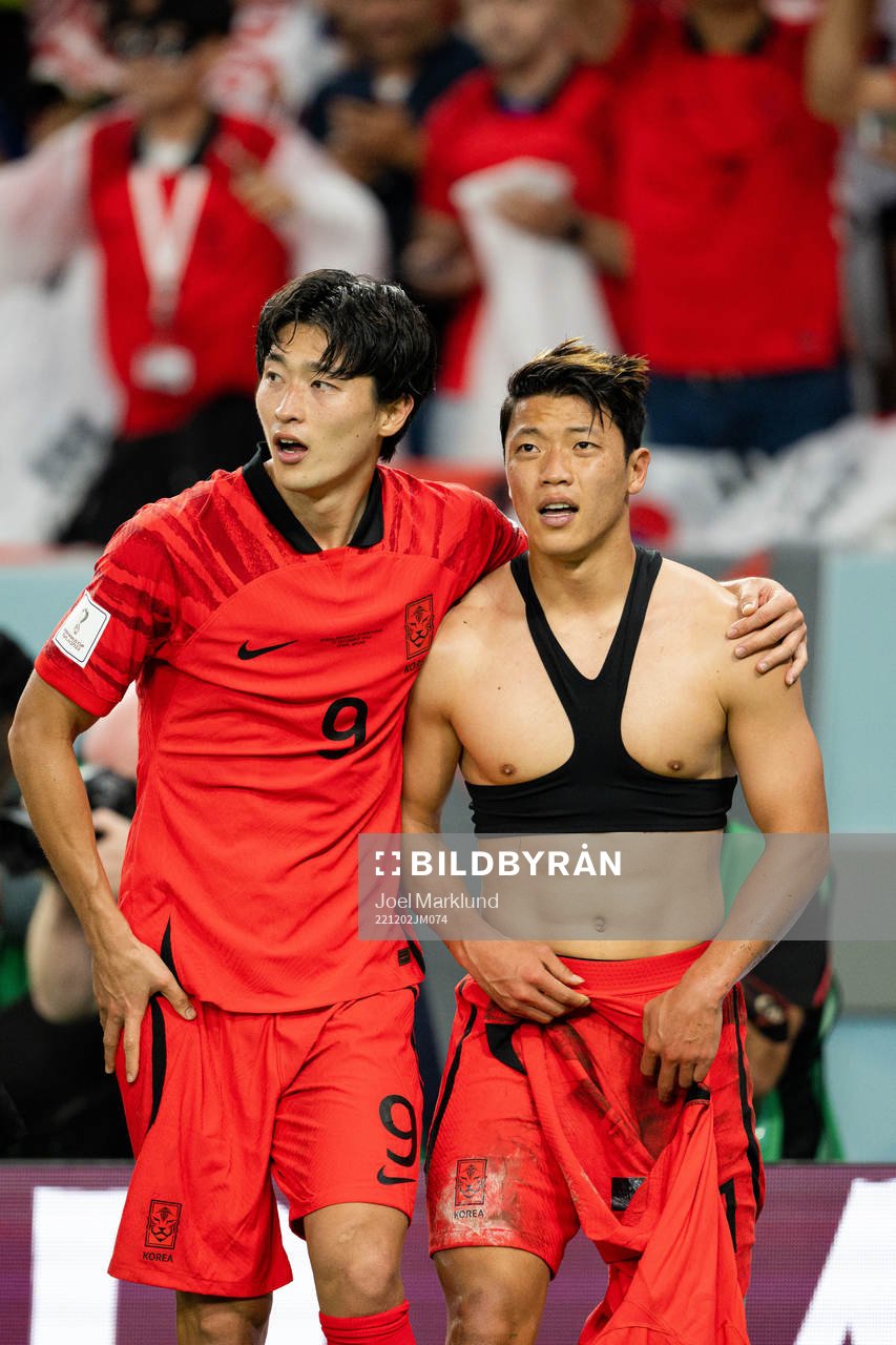 Guesung Cho and Heechan Hwang of South Korea celebrate the