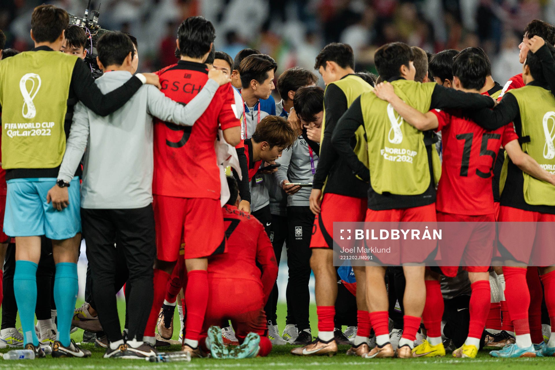 Players of South Korea watch the remaining group stage