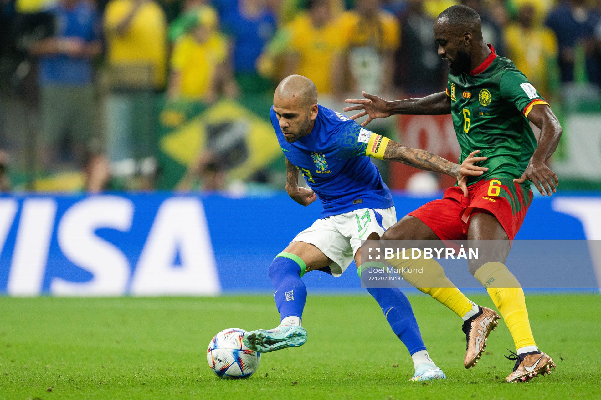 Dani Alves of Brazil and Nicolas Moumi Ngamaleu of Cameroon during the FIFA World Cup 2022 football match between Cameroon and Brazil on December 2, 2022 in Doha.