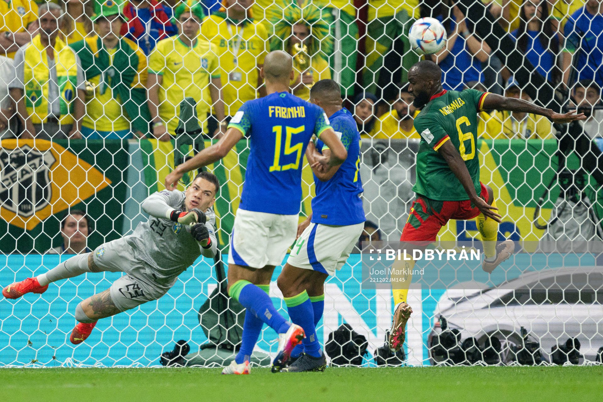 Goalkeeper Ederson of Brazil and Nicolas Moumi Ngamaleu of
