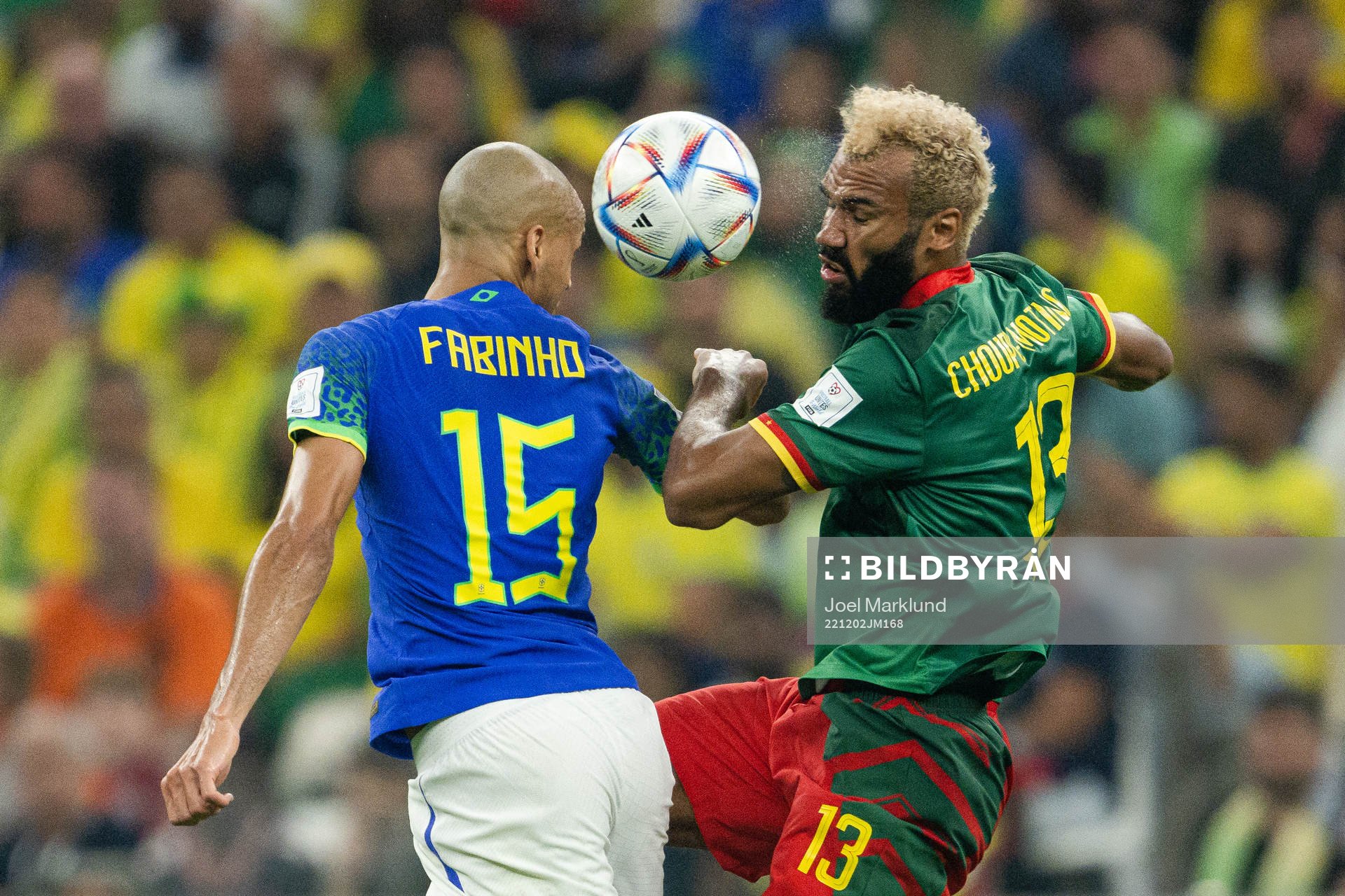 Fabinho of Brazil and Eric Maxim Choupo-Moting of Cameroon