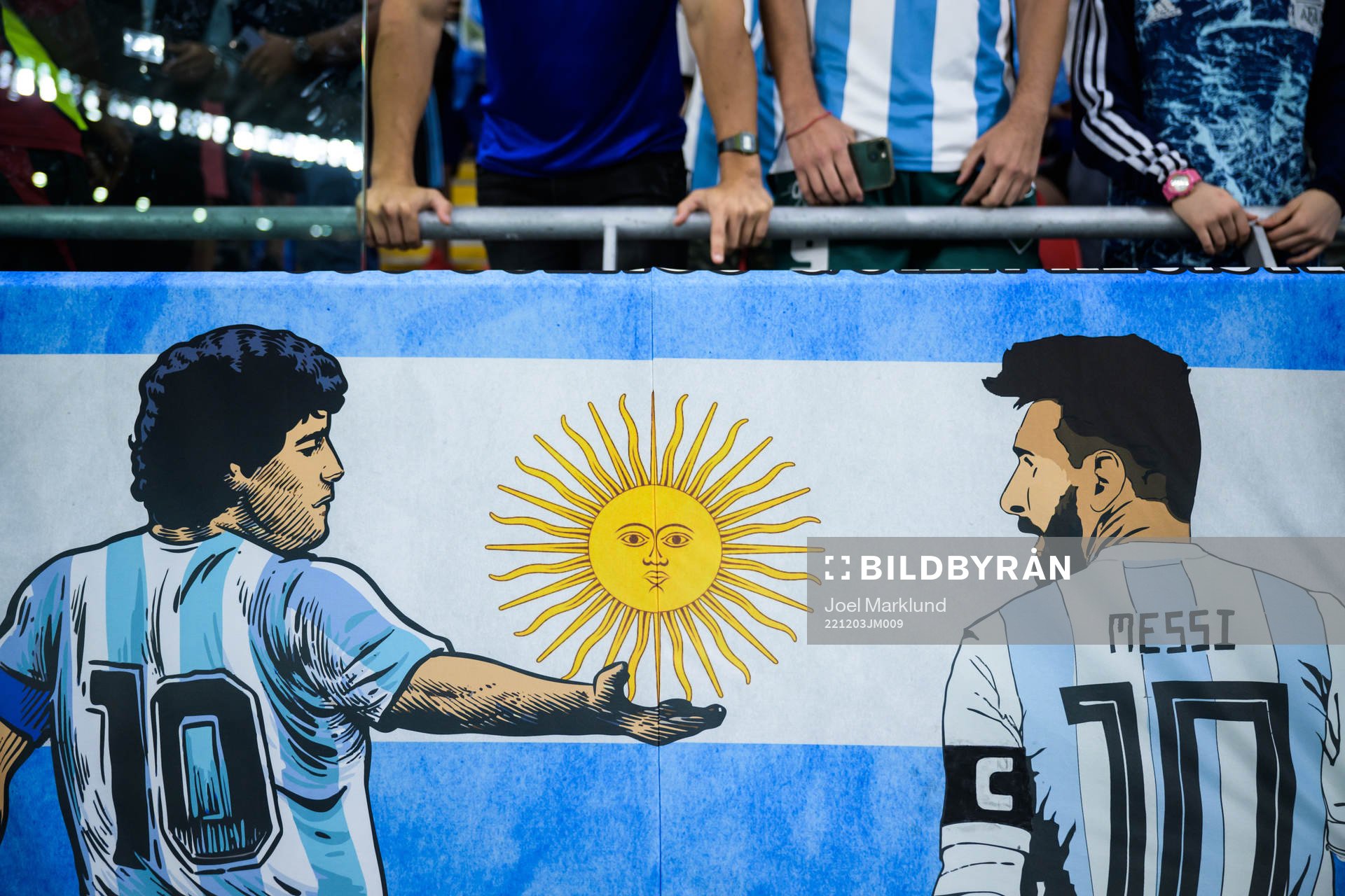 A banner showing Diego Maradona and Lionel Messi of Argentina ahead of the FIFA World Cup 2022 round of 16 football match between Argentina and Australia on December 3, 2022 in Doha.