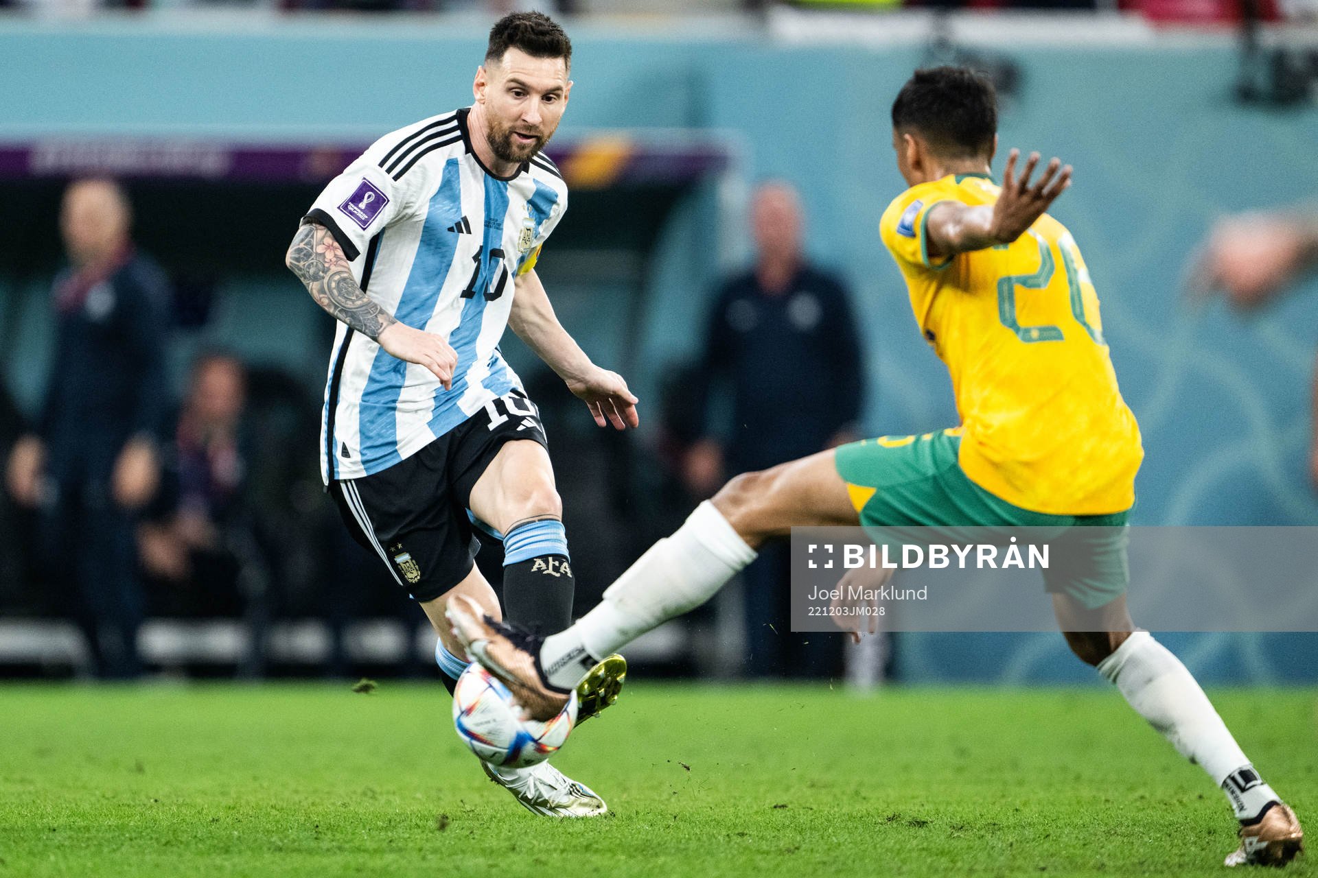 Lionel Messi of Argentina and Keanu Baccus of Australia