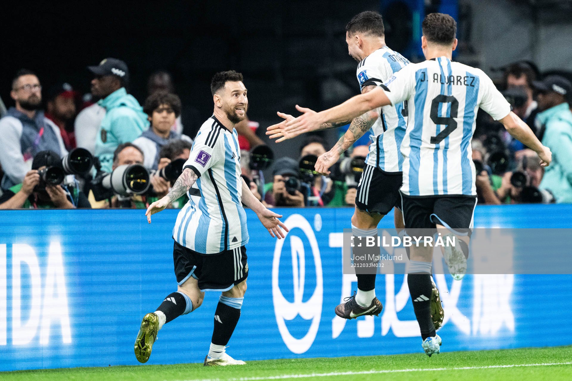 Lionel Messi of Argentina celebrates with Nicolas Otamendi