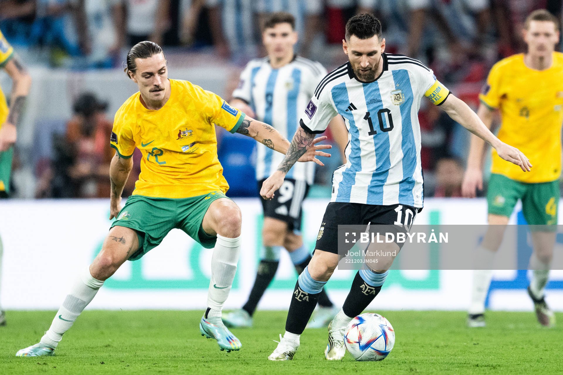 Jackson Irvine of Australia and Lionel Messi of Argentina