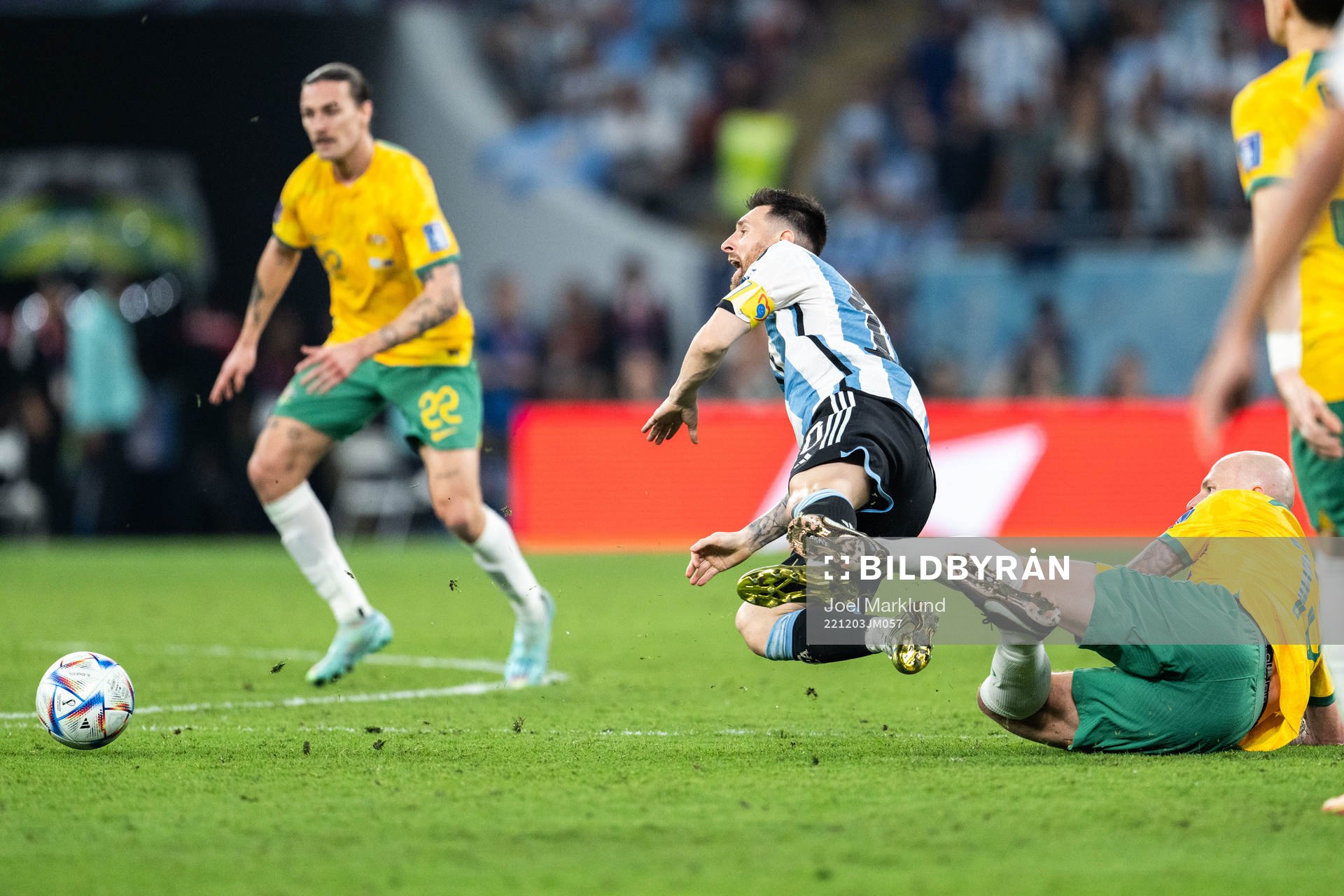 Lionel Messi of Argentina is tackled by Aaron Mooy of