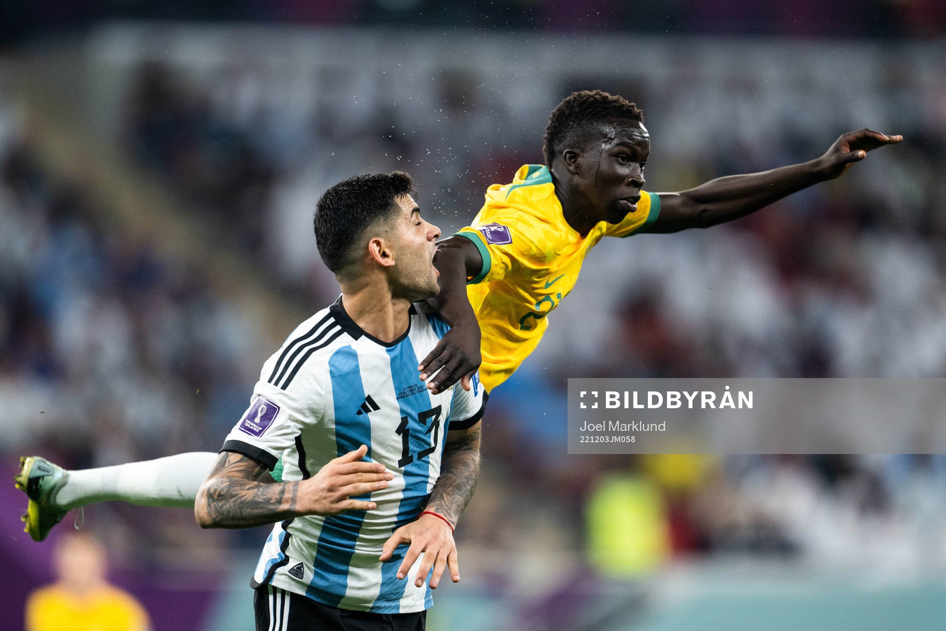 Cristian Romero of Argentina and Garang Kuol of Australia