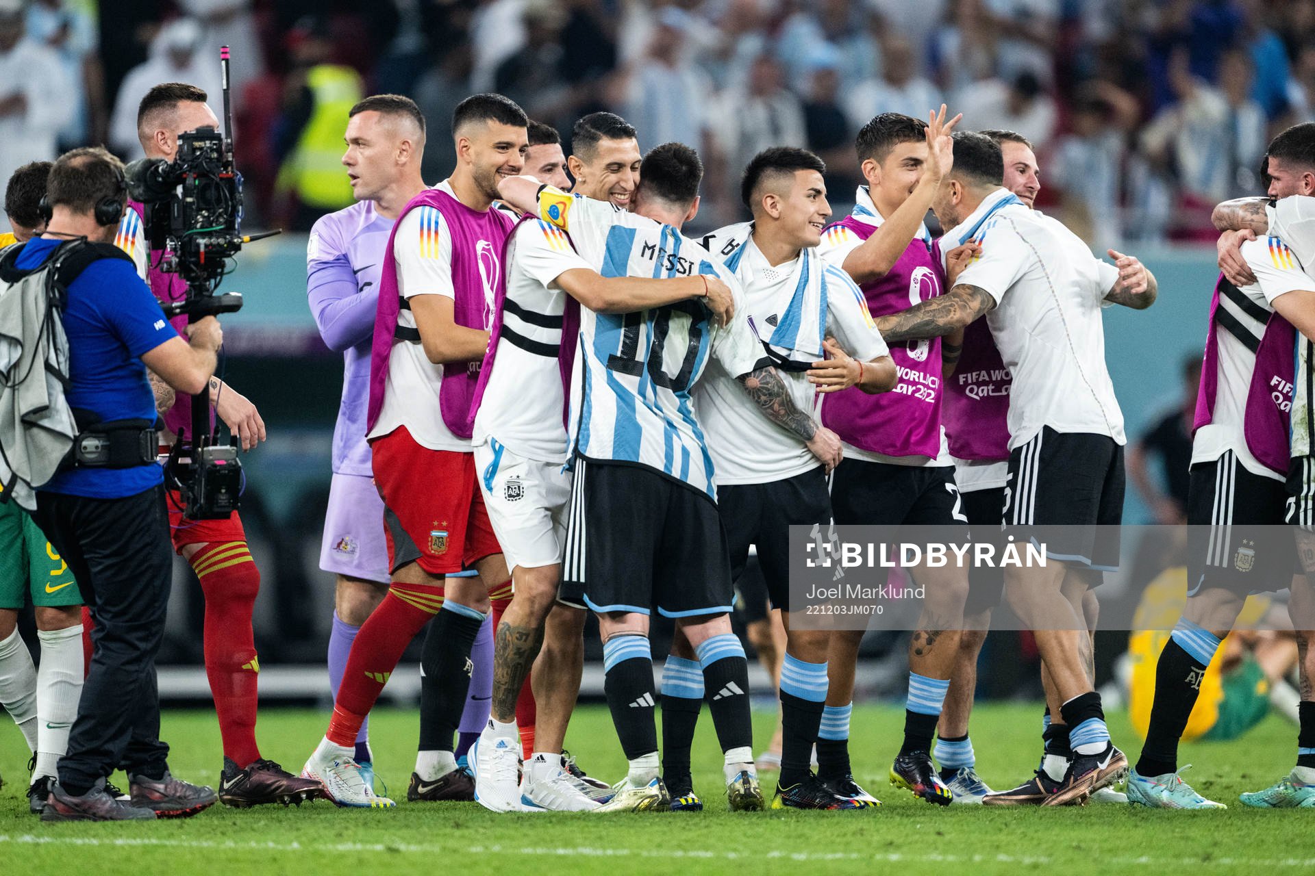 Angel de Maria and Thiago Almada hugs Lionel Messi of