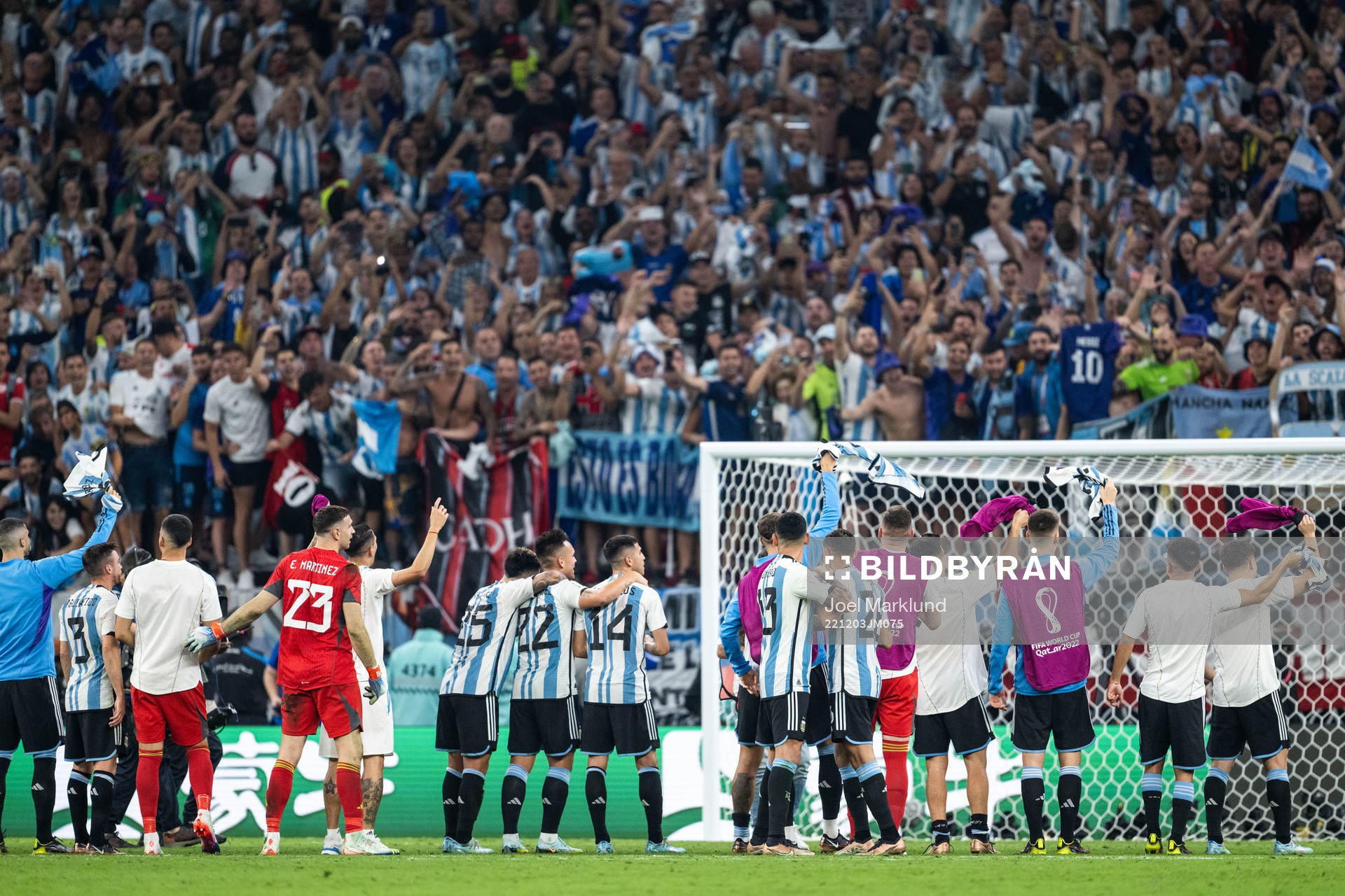 Players of Argentina celebrate with fans