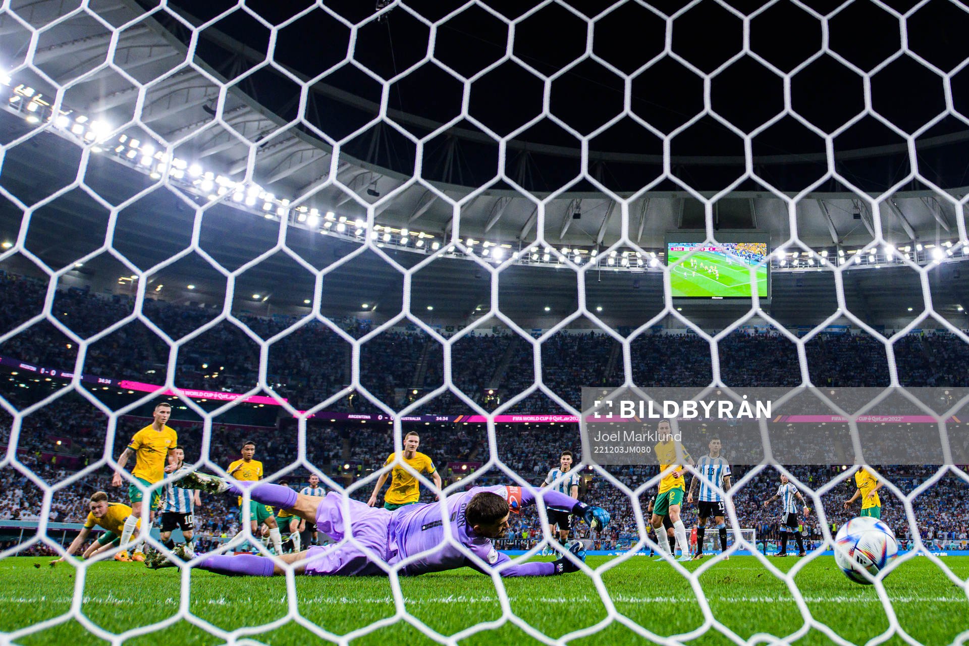 Lionel Messi of Argentina scores the 1-0 goal behind
