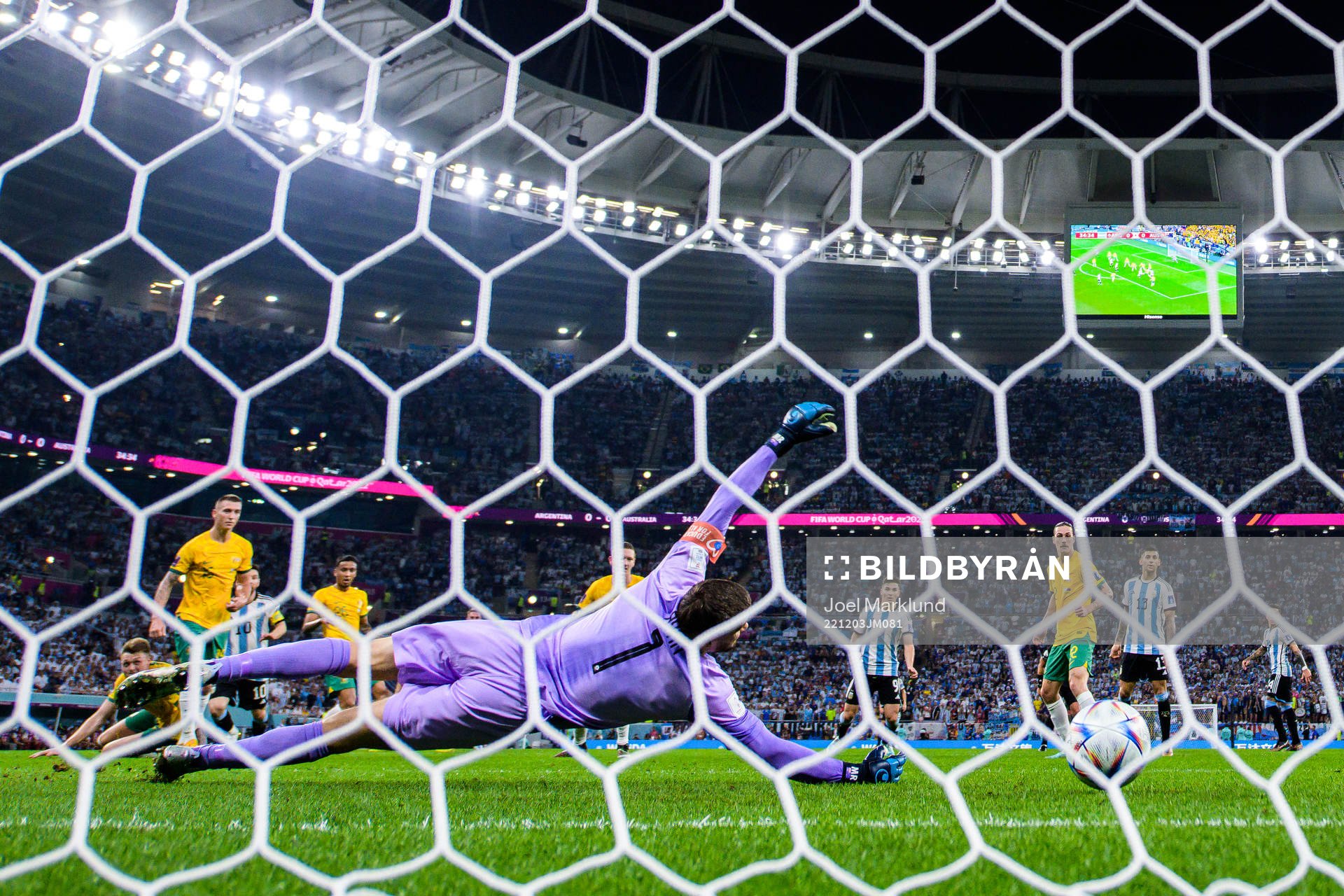 Lionel Messi of Argentina scores the 1-0 goal behind