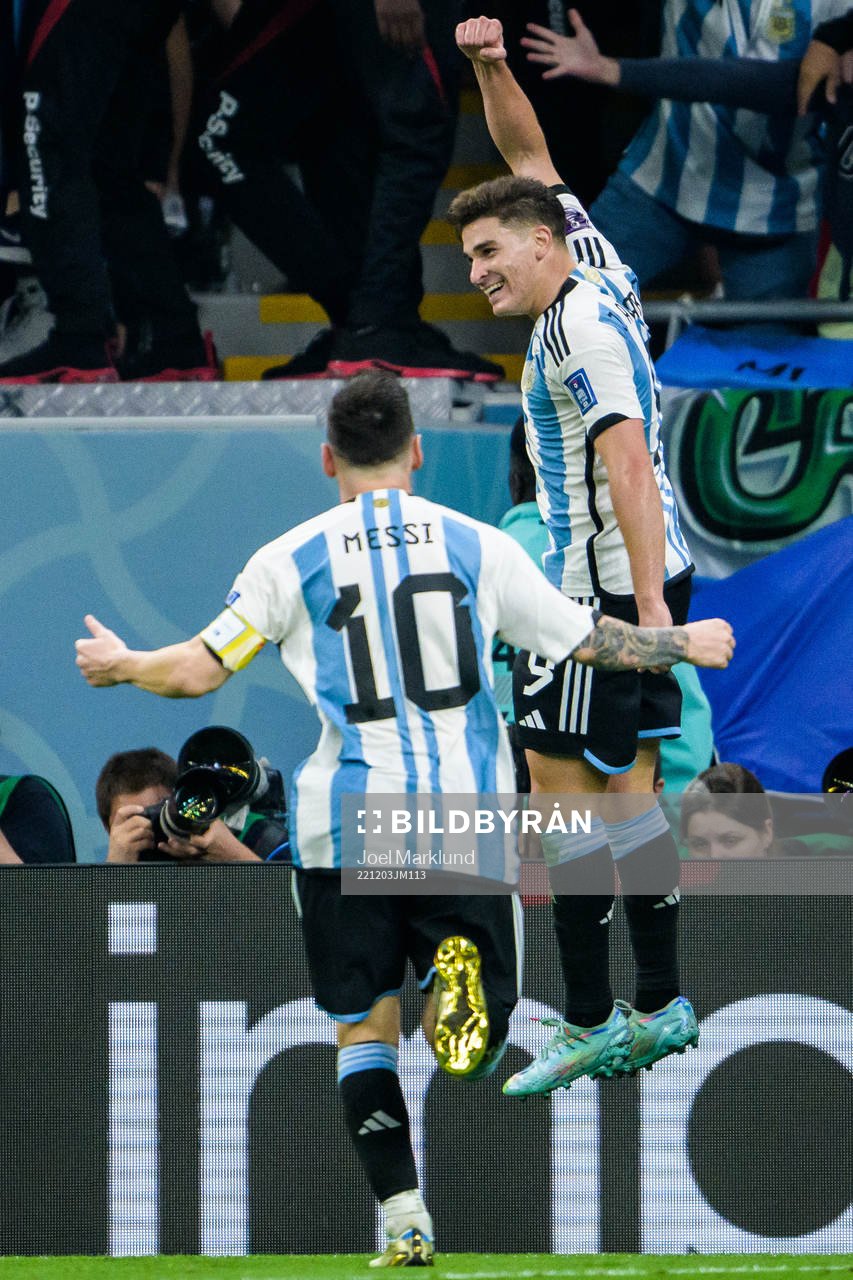 Lionel Messi and Julian Alvarez of Argentina celebrate the