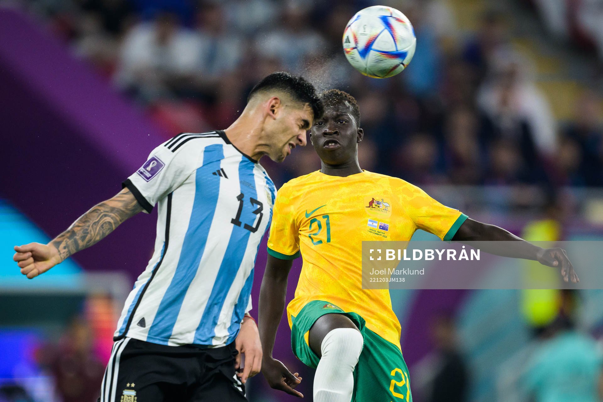 Cristian Romero of Argentina and Garang Kuol of Australia
