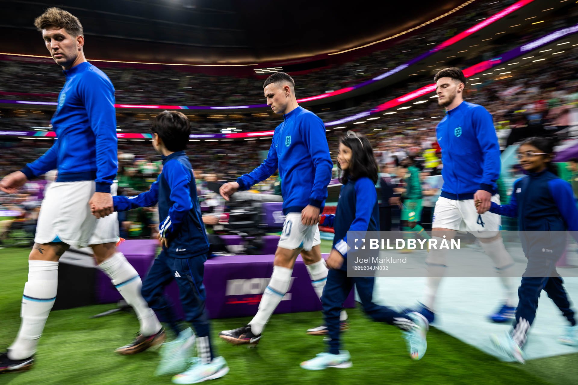 John Stones, Phil Foden and Declan Rice of England ahead of the FIFA World Cup 2022 round of 16 football match between England and Senegal on December 4, 2022 in Doha. 