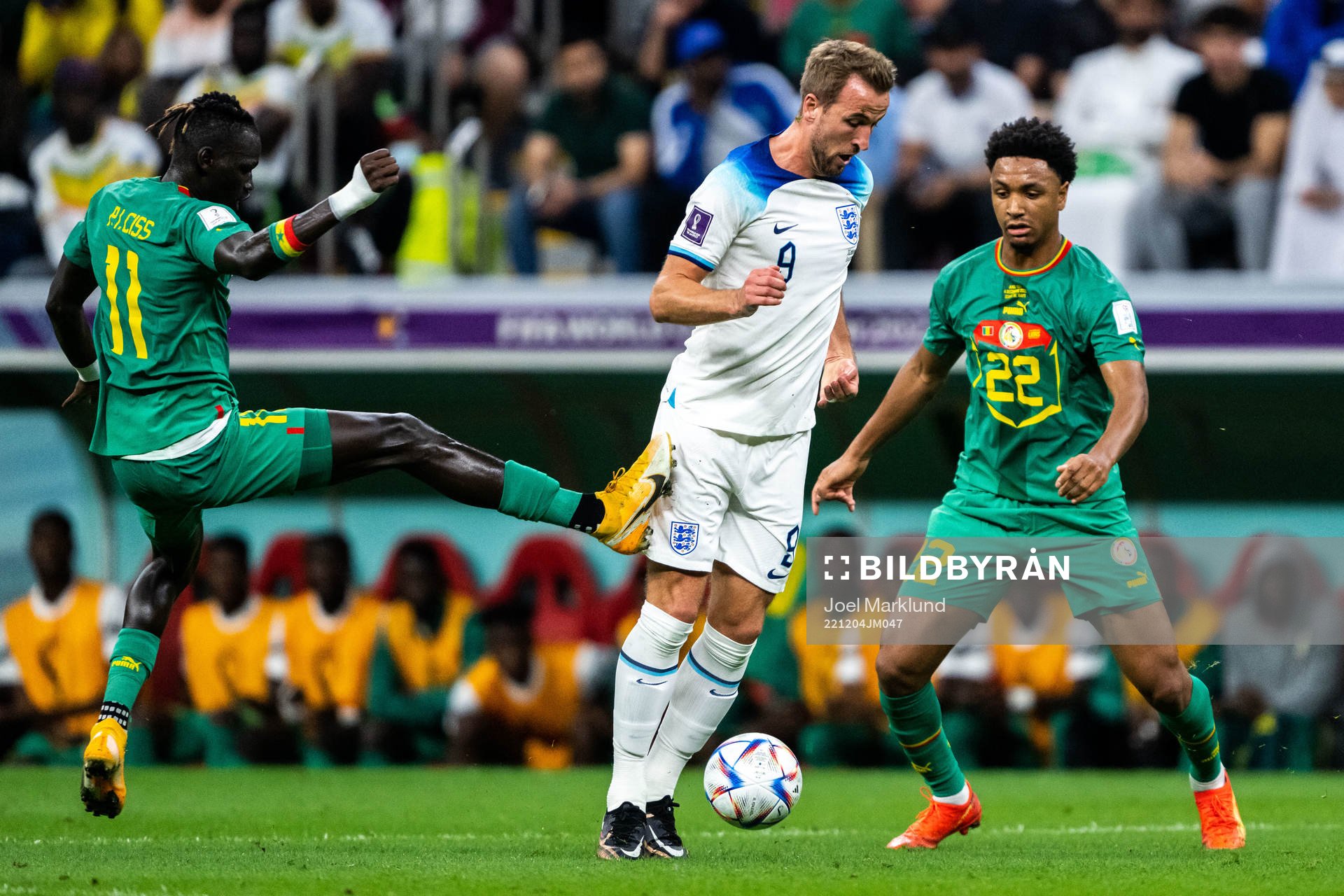 Pathe Ciss and Abdou Diallo of Senegal and Harry Kane of