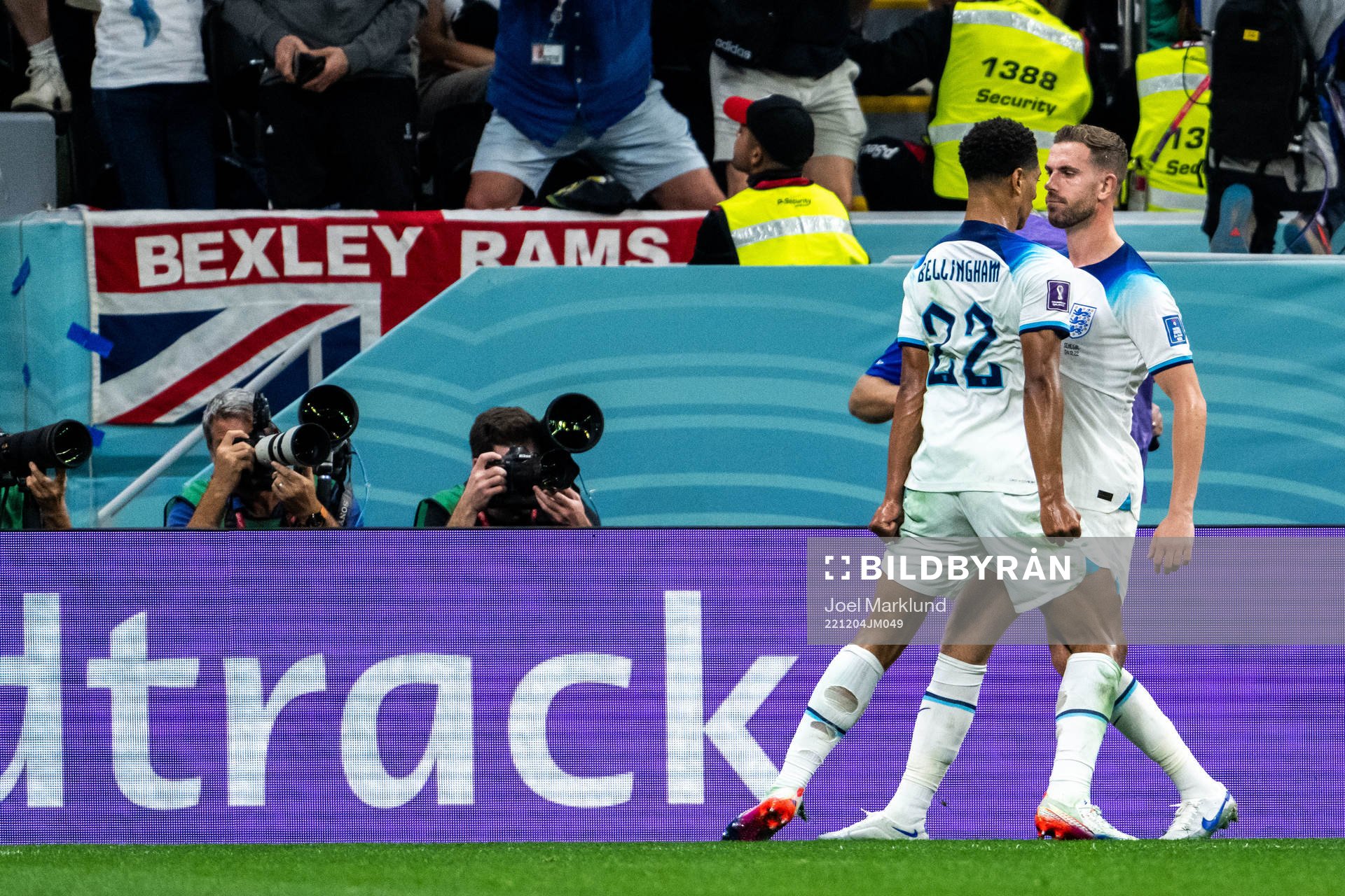 Jude Bellingham and Jordan Henderson of England celebrate
