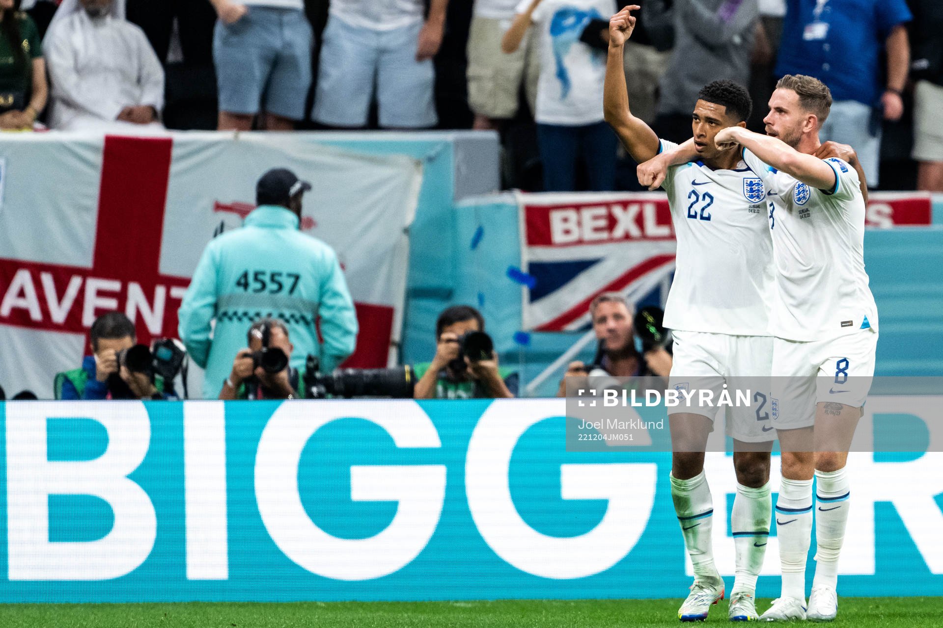 Jude Bellingham and Jordan Henderson of England celebrate