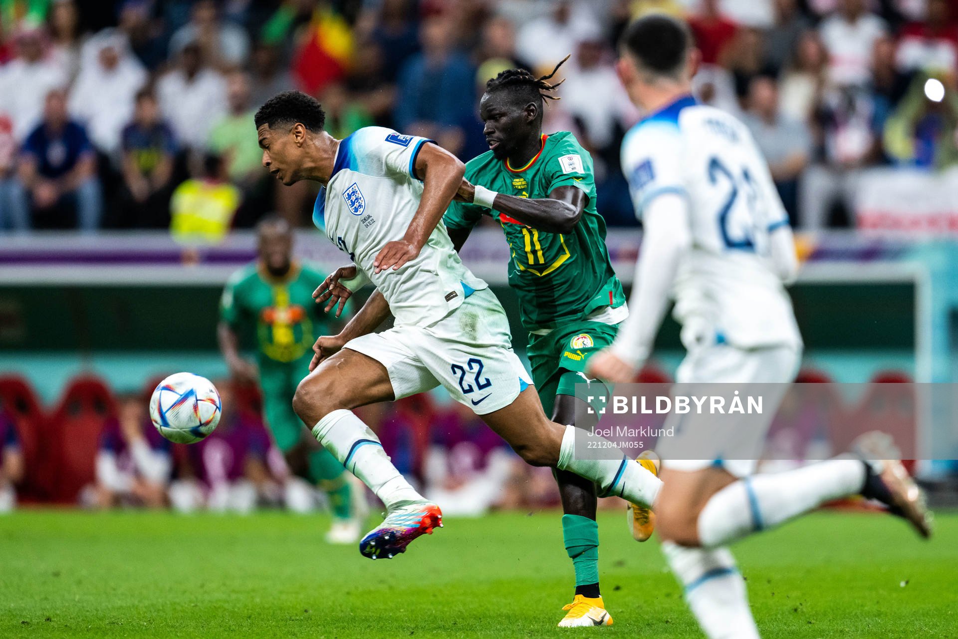Jude Bellingham of England and Pathe Ciss of Senegal
