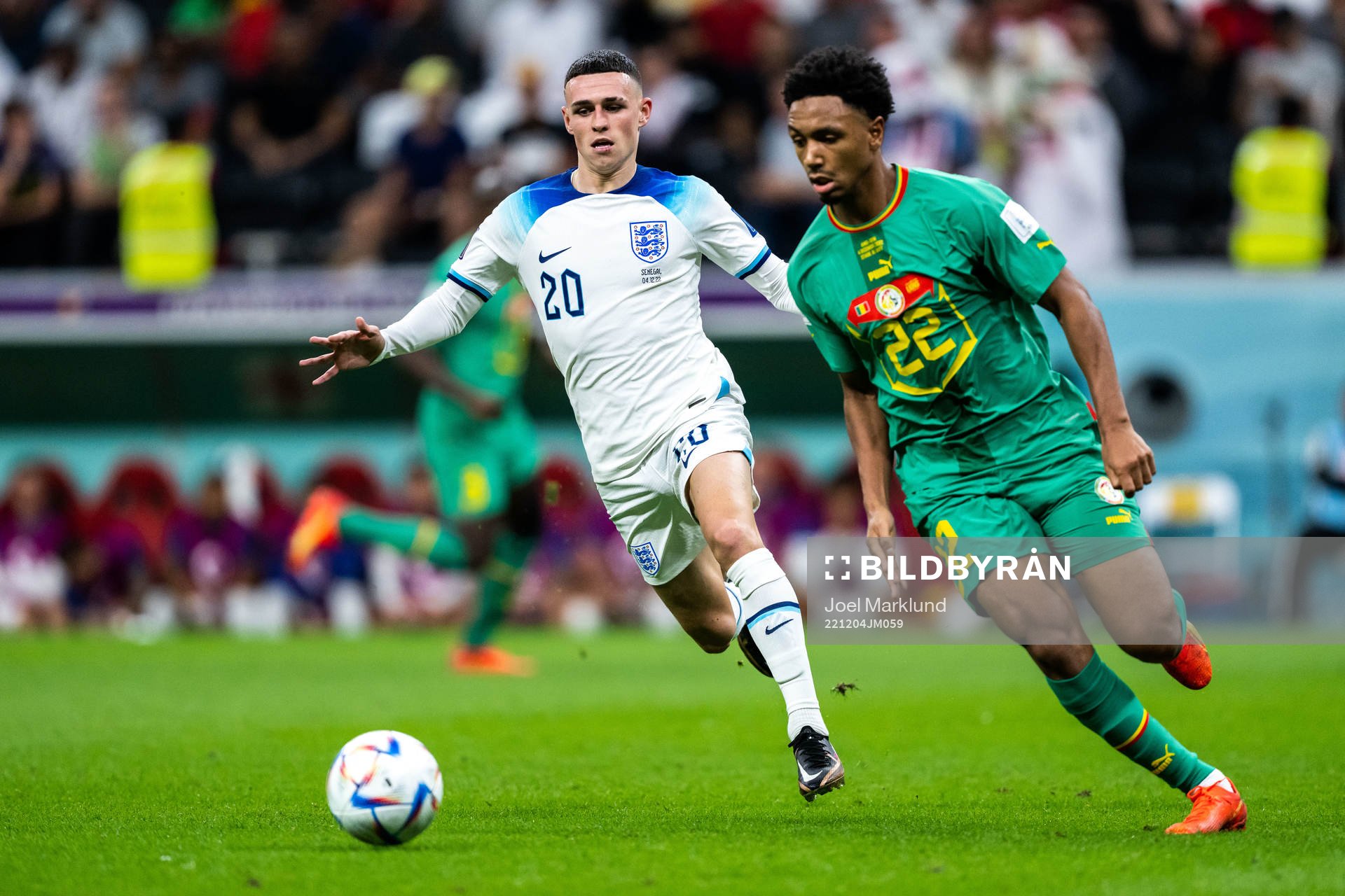 Phil Foden of England and Fabian Schaerof Senegal