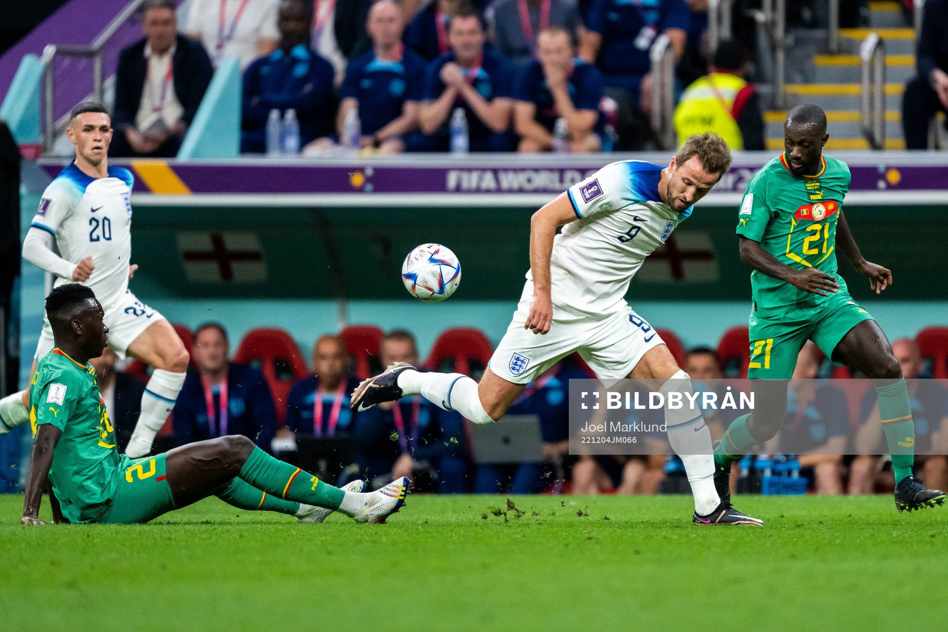 Pape Gueye and Youssouf Sabaly of Senegal and Harry Kane of