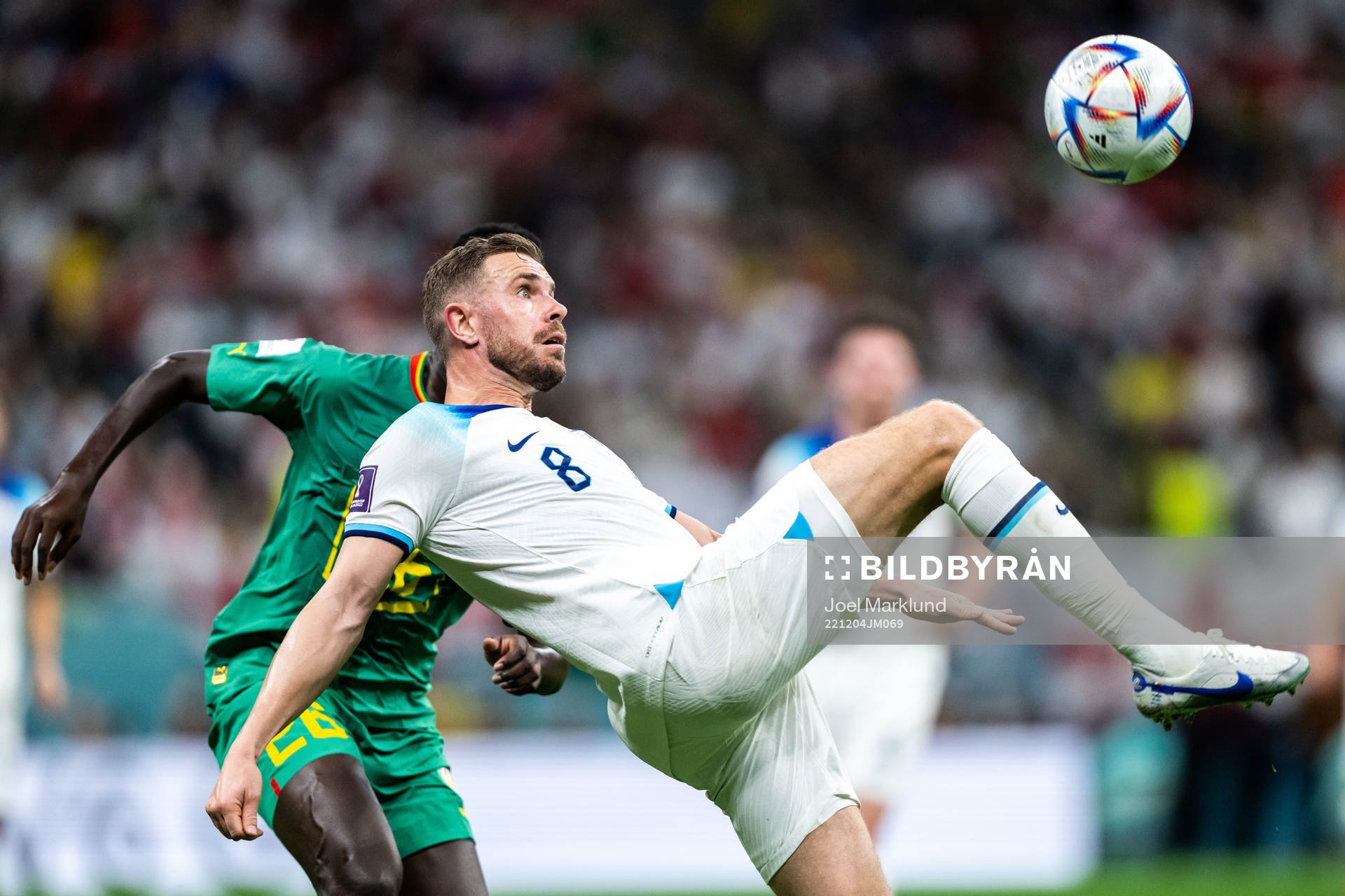 Pape Gueye of Senegal and Jordan Henderson of England