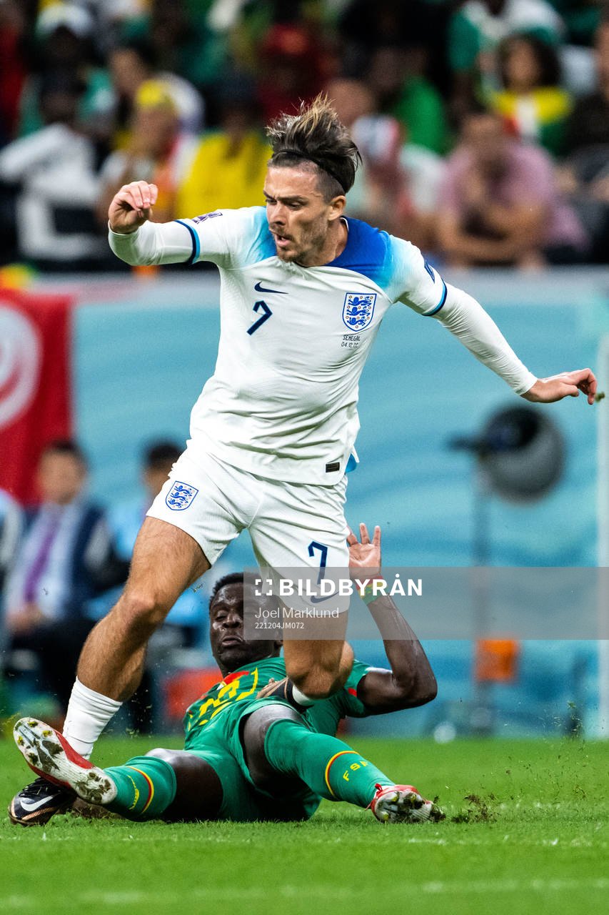 Jack Grealish of England and Bamba Dieng of Senegal