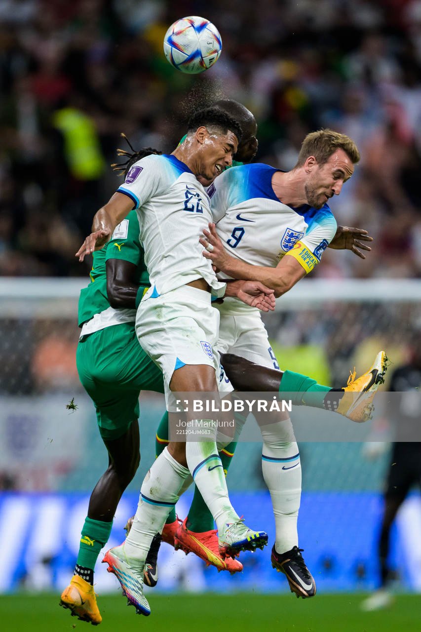 Jude Bellingham and Harry Kane of England in action against