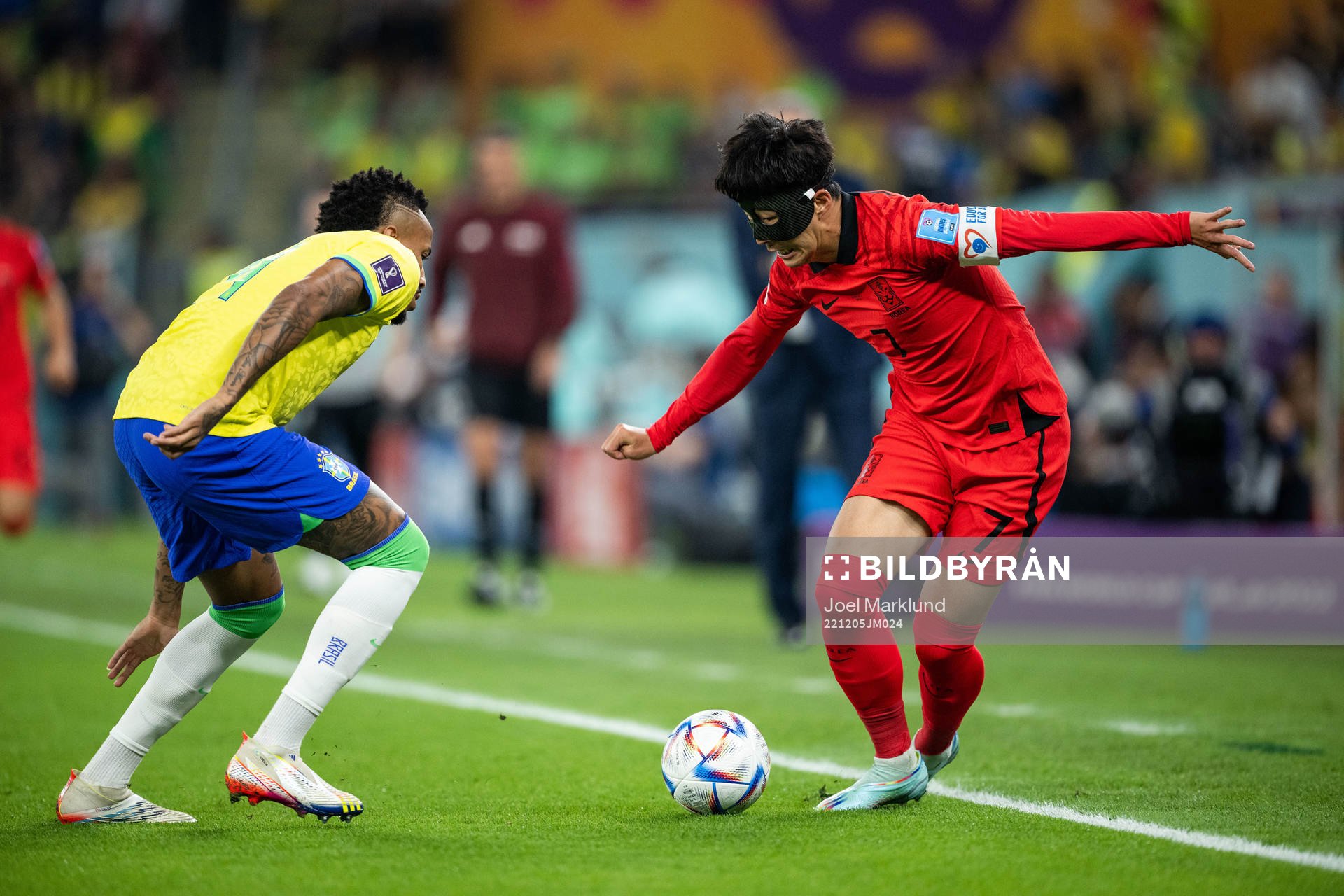 Eder Militao of Brazil and Heungmin Son of South Korea