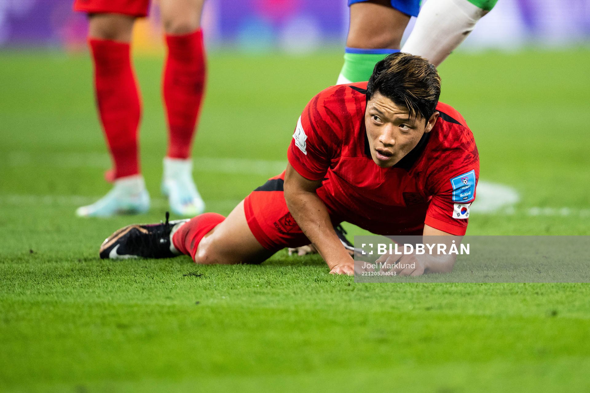 Heechan Hwang of South Korea looks dejected