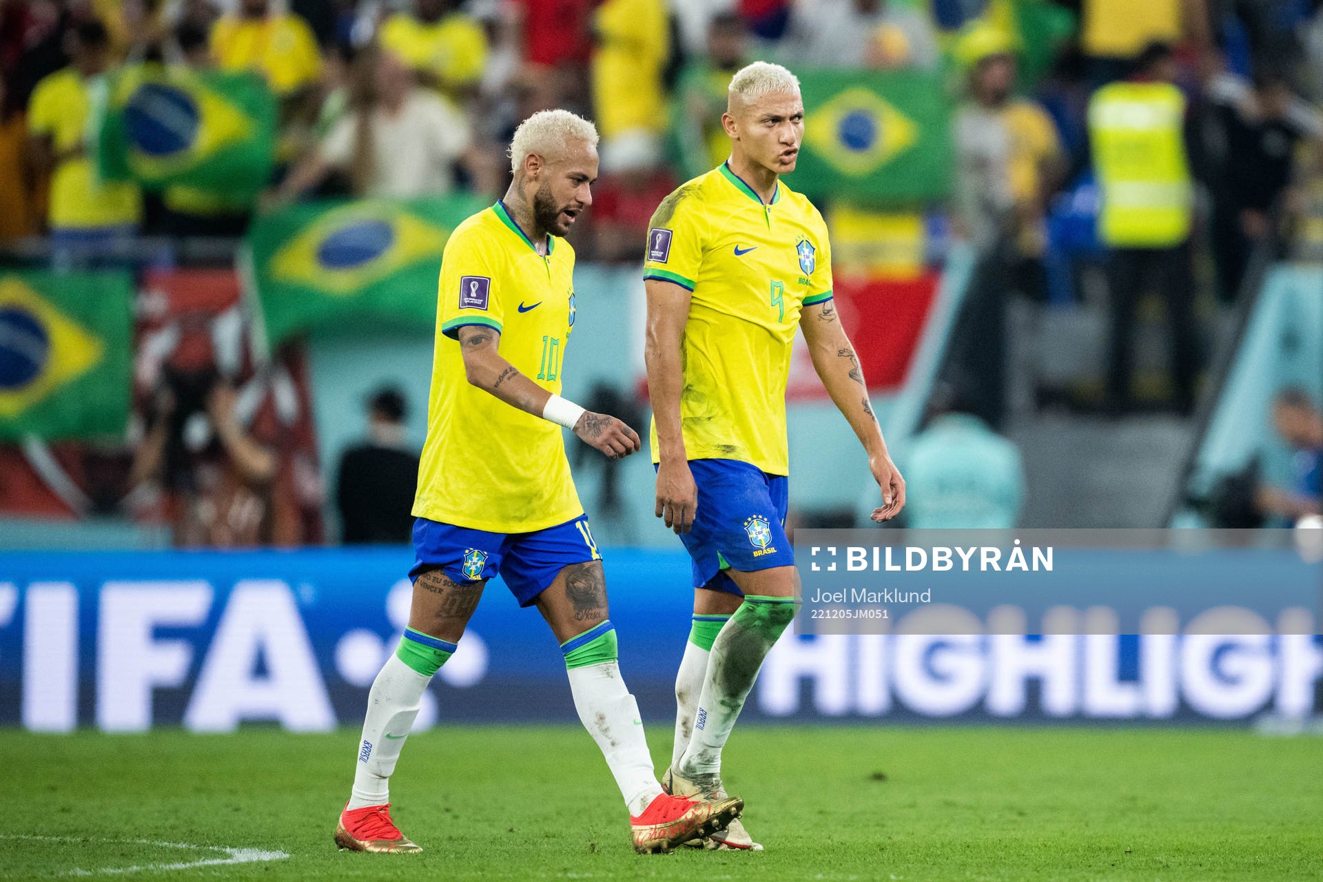 Neymar and Richarlison of Brazil at halftime