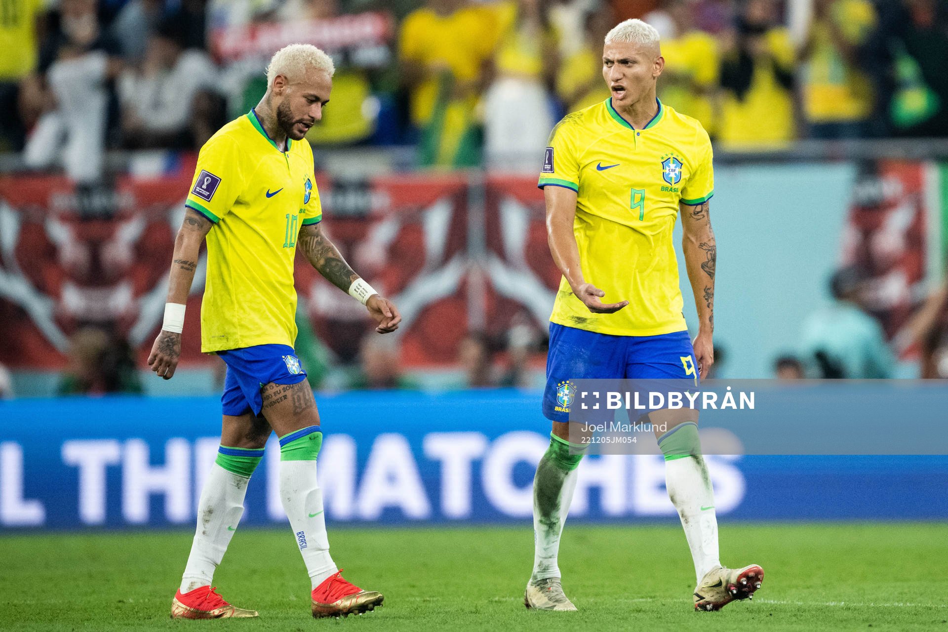 Neymar and Richarlison of Brazil at halftime