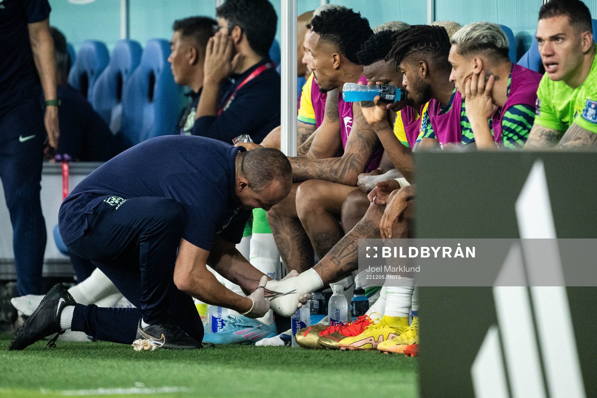 Neymar of Brazil receives medical attention