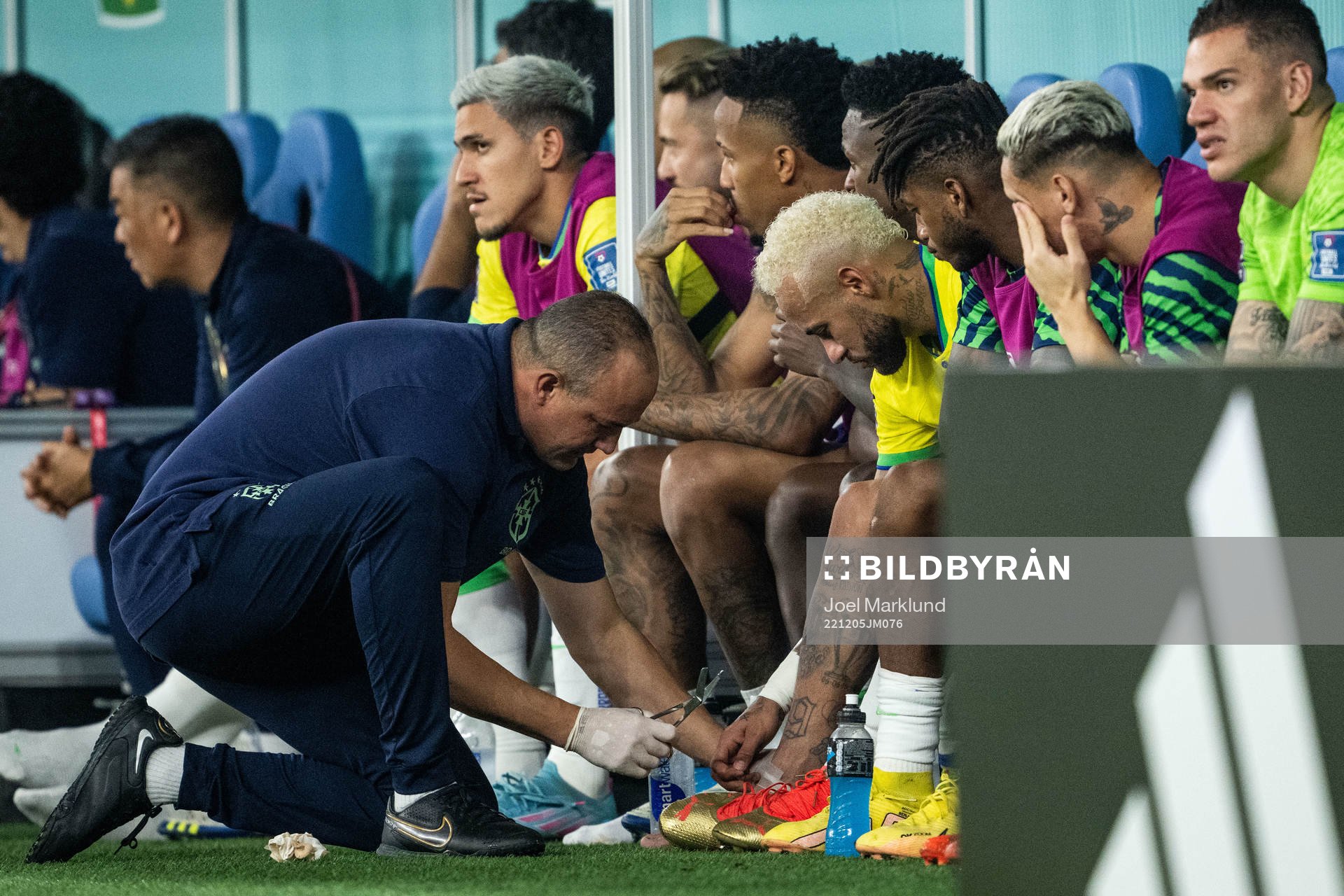 Neymar of Brazil receives medical attention
