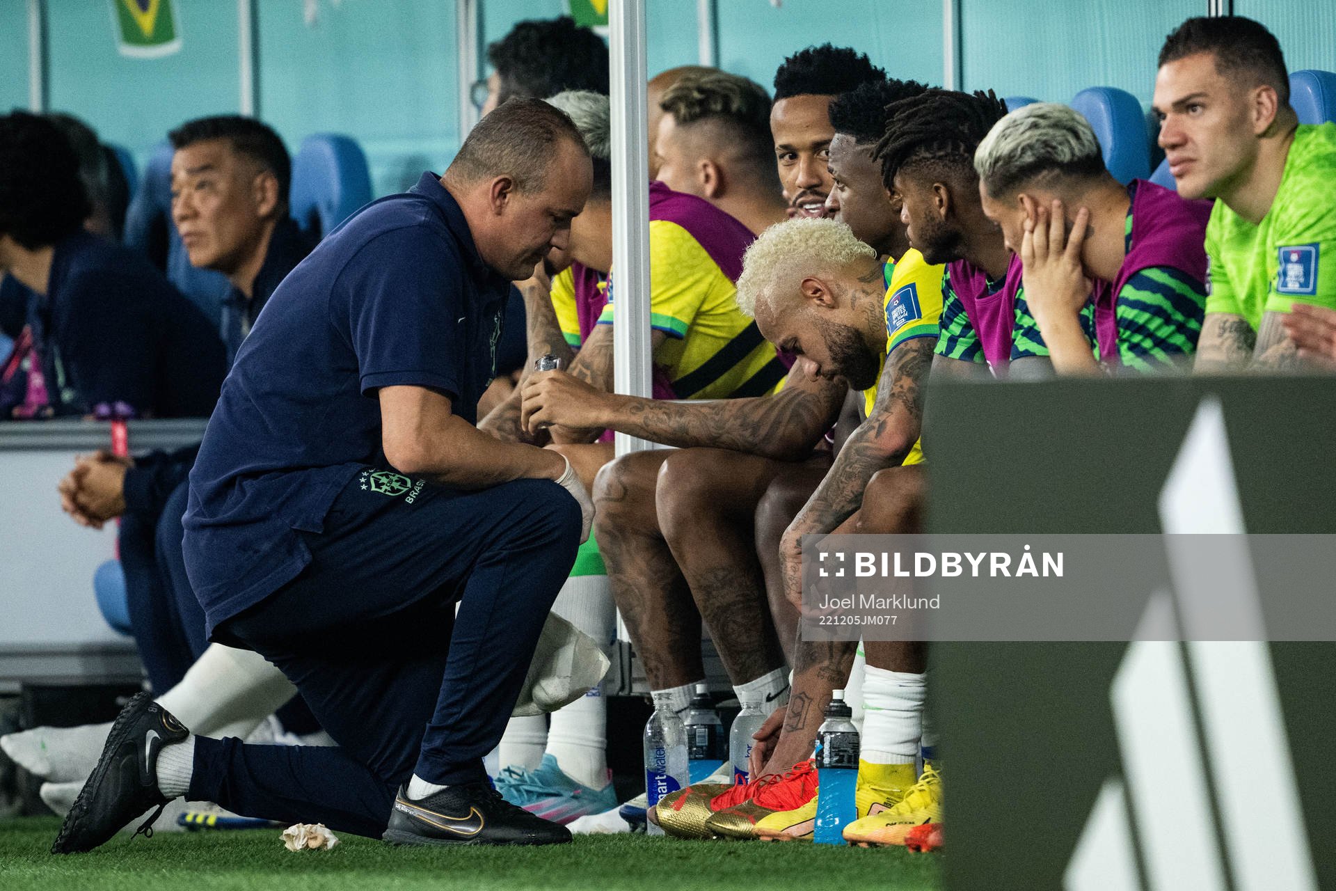 Neymar of Brazil receives medical attention