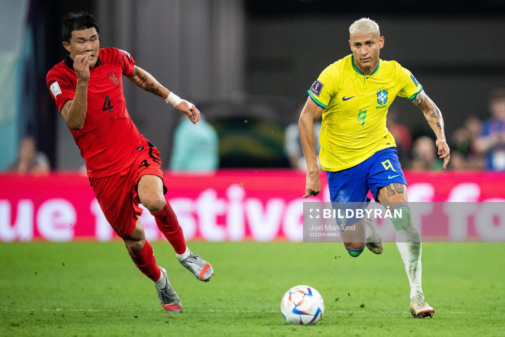 Minjae Kim of South Korea and Richarlison of Brazil