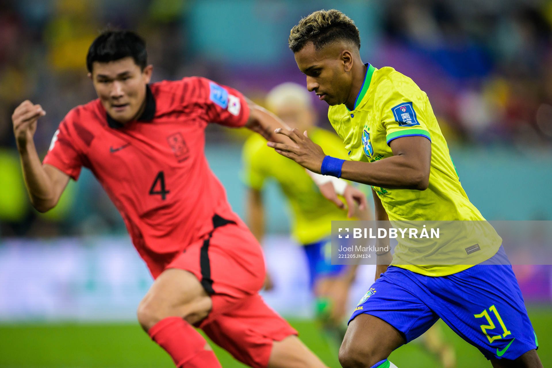 Minjae Kim of South Korea and Rodrygo of Brazil