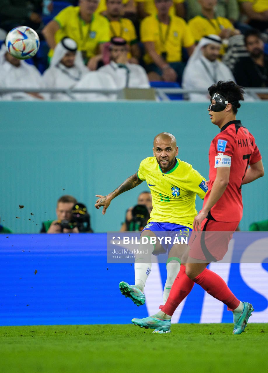 Dani Alves of Brazil and Heungmin Son of South Korea